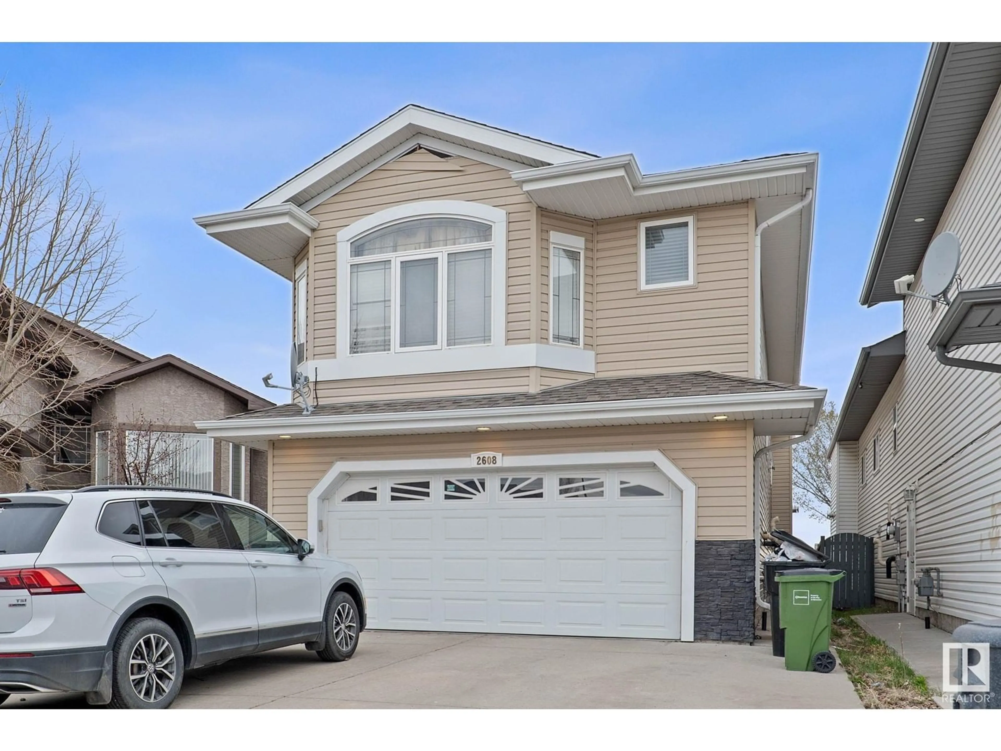 Home with vinyl exterior material, street for 2608 31 STREET, Edmonton Alberta T6T1R2