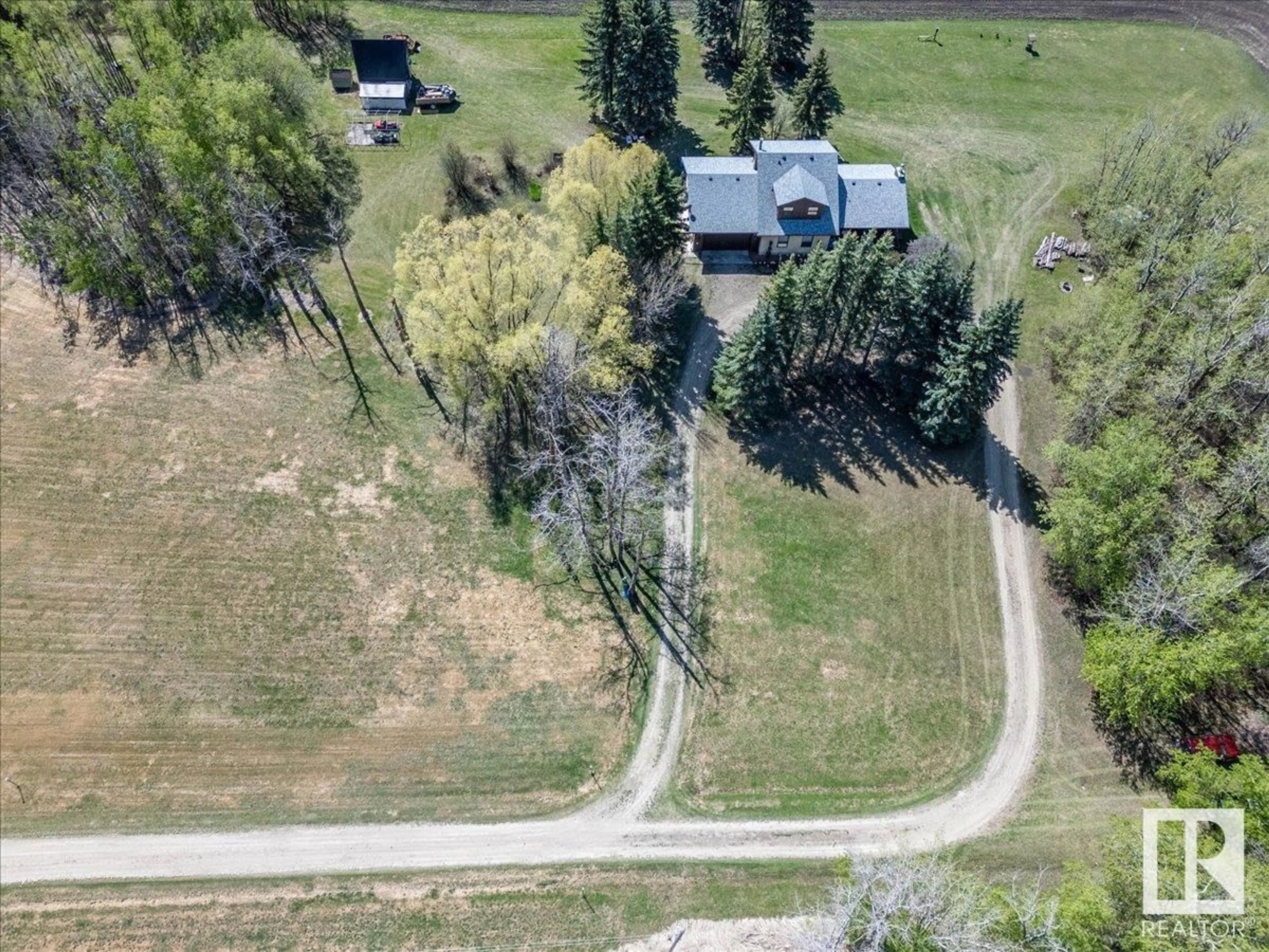 A pic from outside/outdoor area/front of a property/back of a property/a pic from drone, street for 48440 RGE ROAD 273, Rural Leduc County Alberta T0C0V0