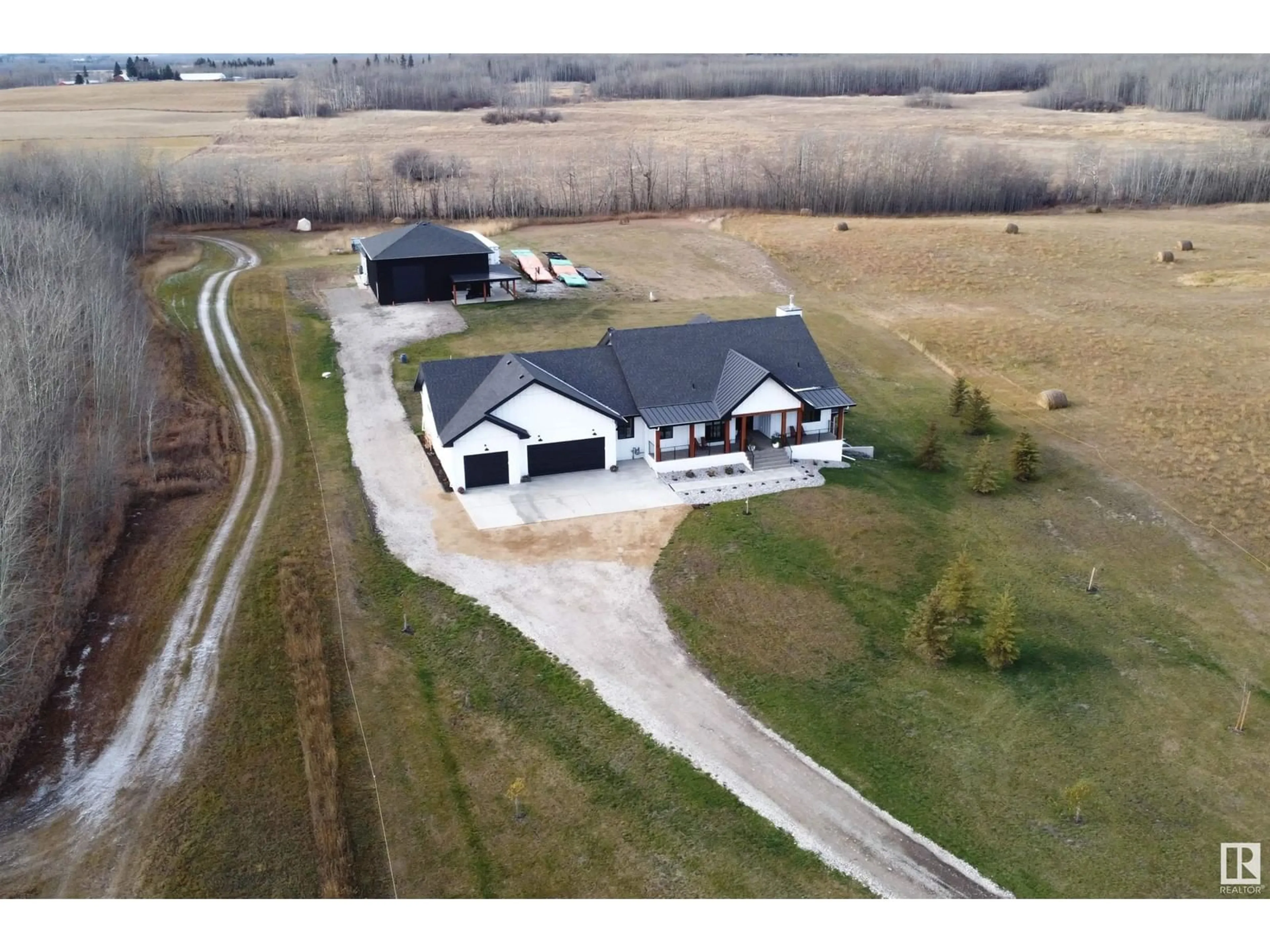 A pic from outside/outdoor area/front of a property/back of a property/a pic from drone, building for 155 22111 TWP ROAD 510, Rural Leduc County Alberta T0B3M2