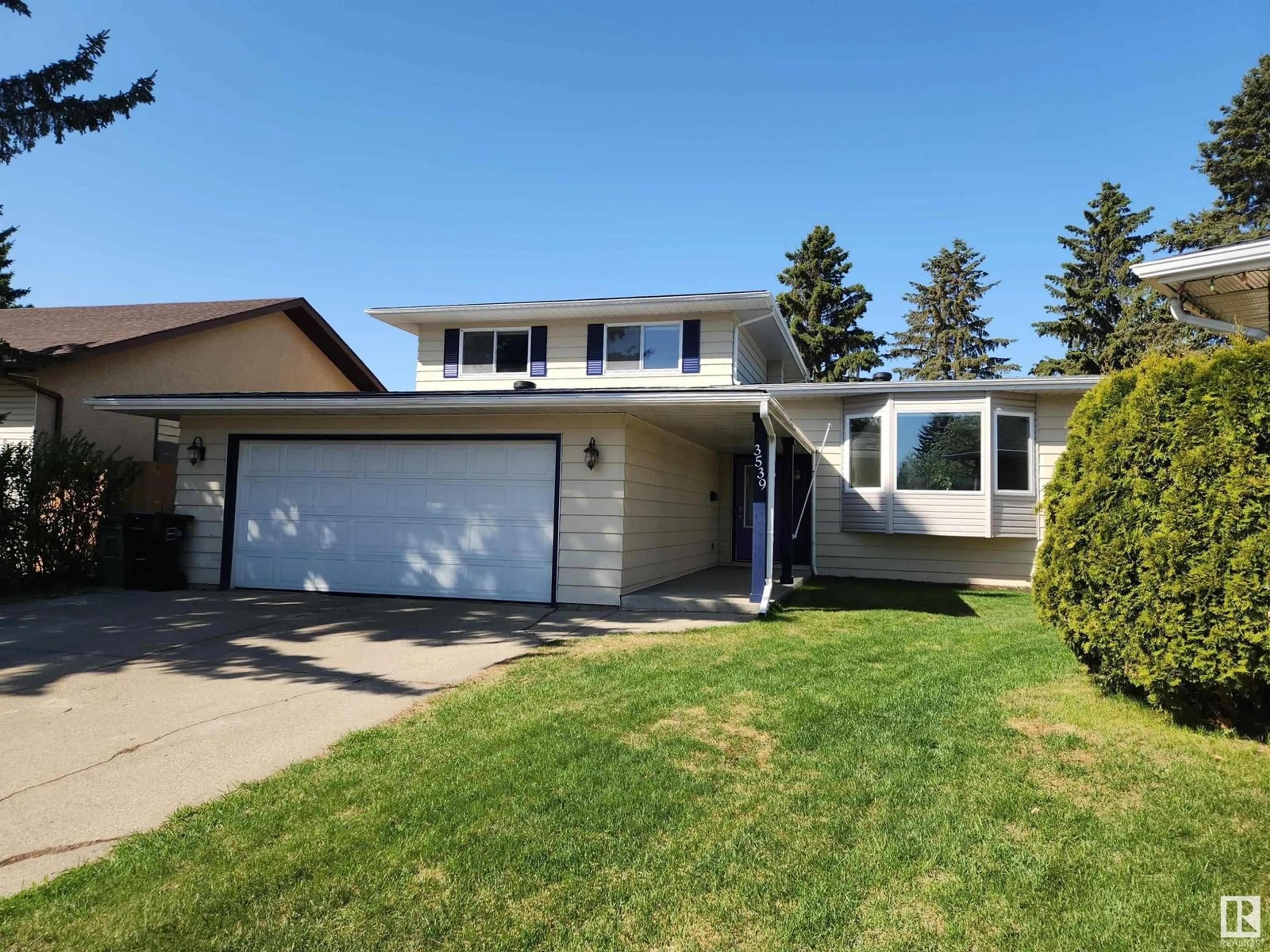 Home with vinyl exterior material, street for 3539 11 AV, Edmonton Alberta T6L2L5