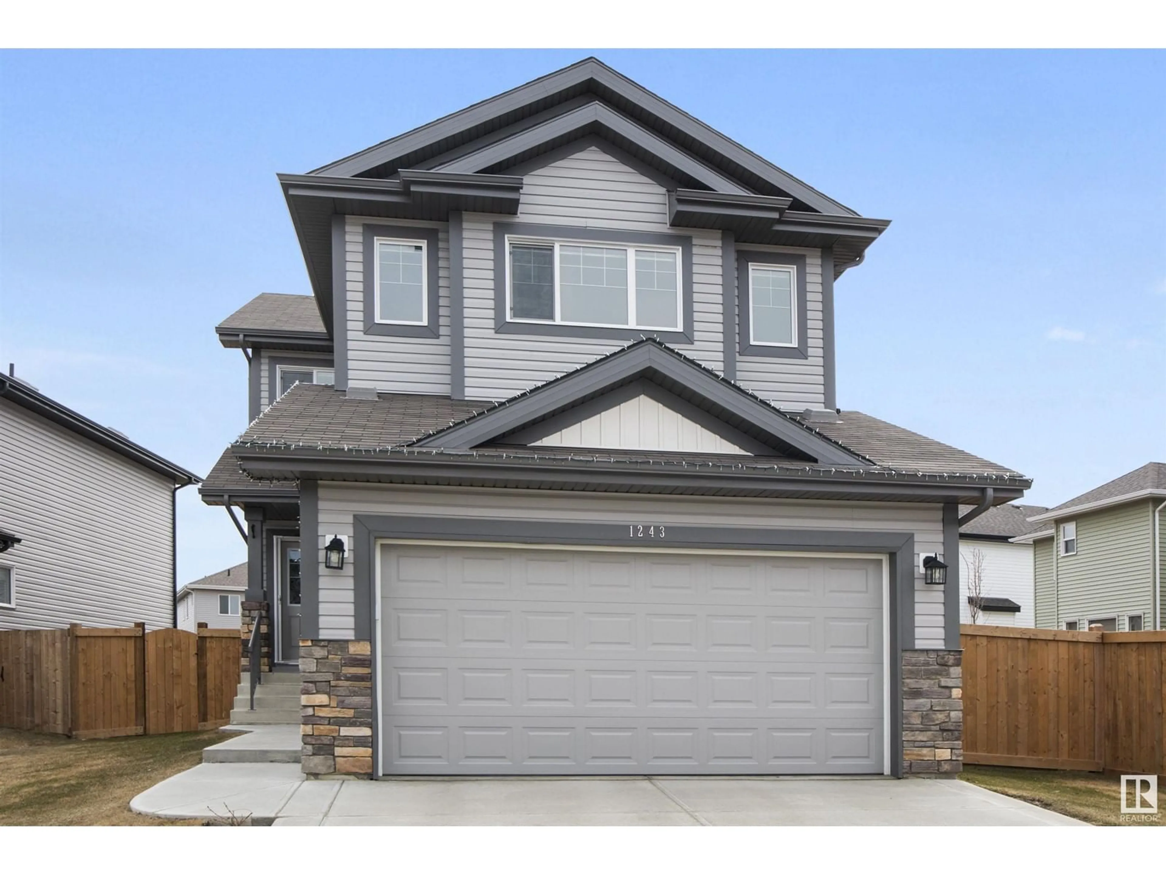 Home with vinyl exterior material, street for NW - 1243 25 AVENUE, Edmonton Alberta T6T2E5