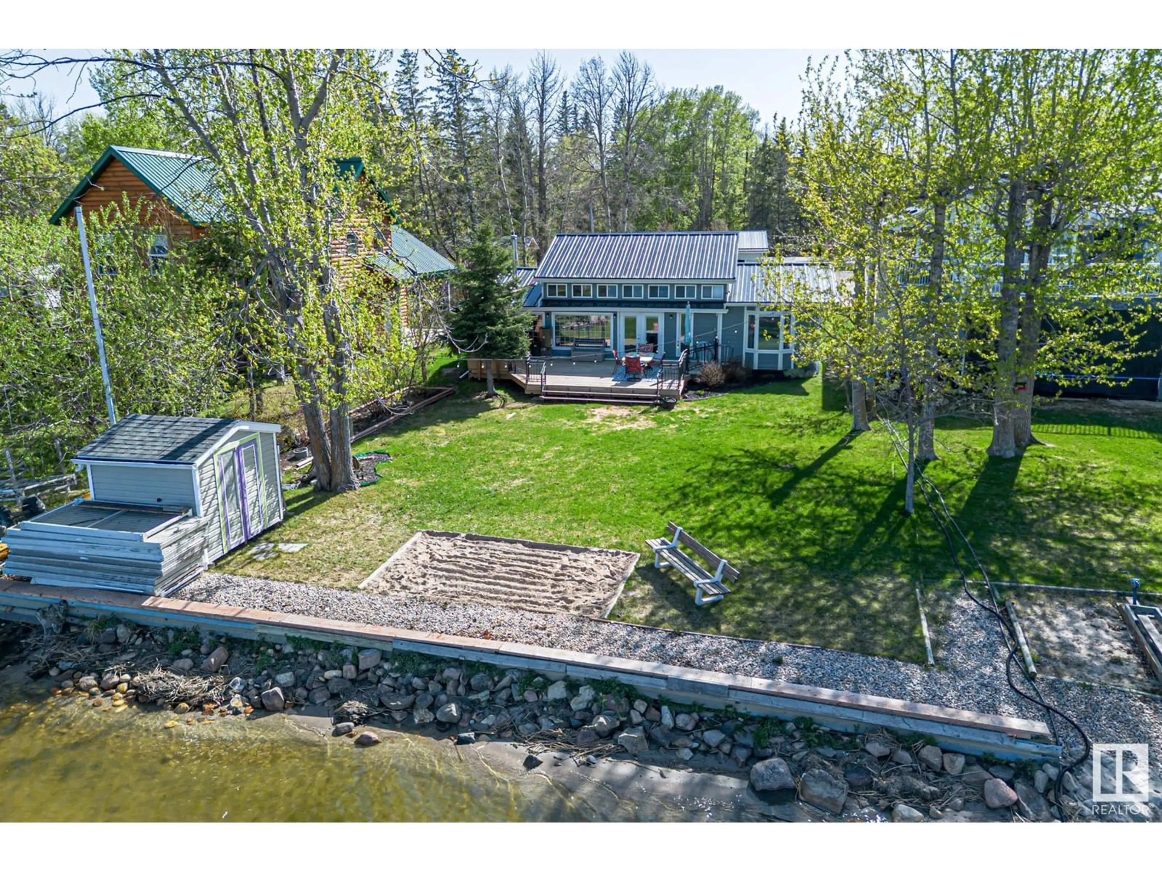 A pic from outside/outdoor area/front of a property/back of a property/a pic from drone, water/lake/river/ocean view for 30 2531 TWP RD 572, Rural Lac Ste. Anne County Alberta T0E1A0