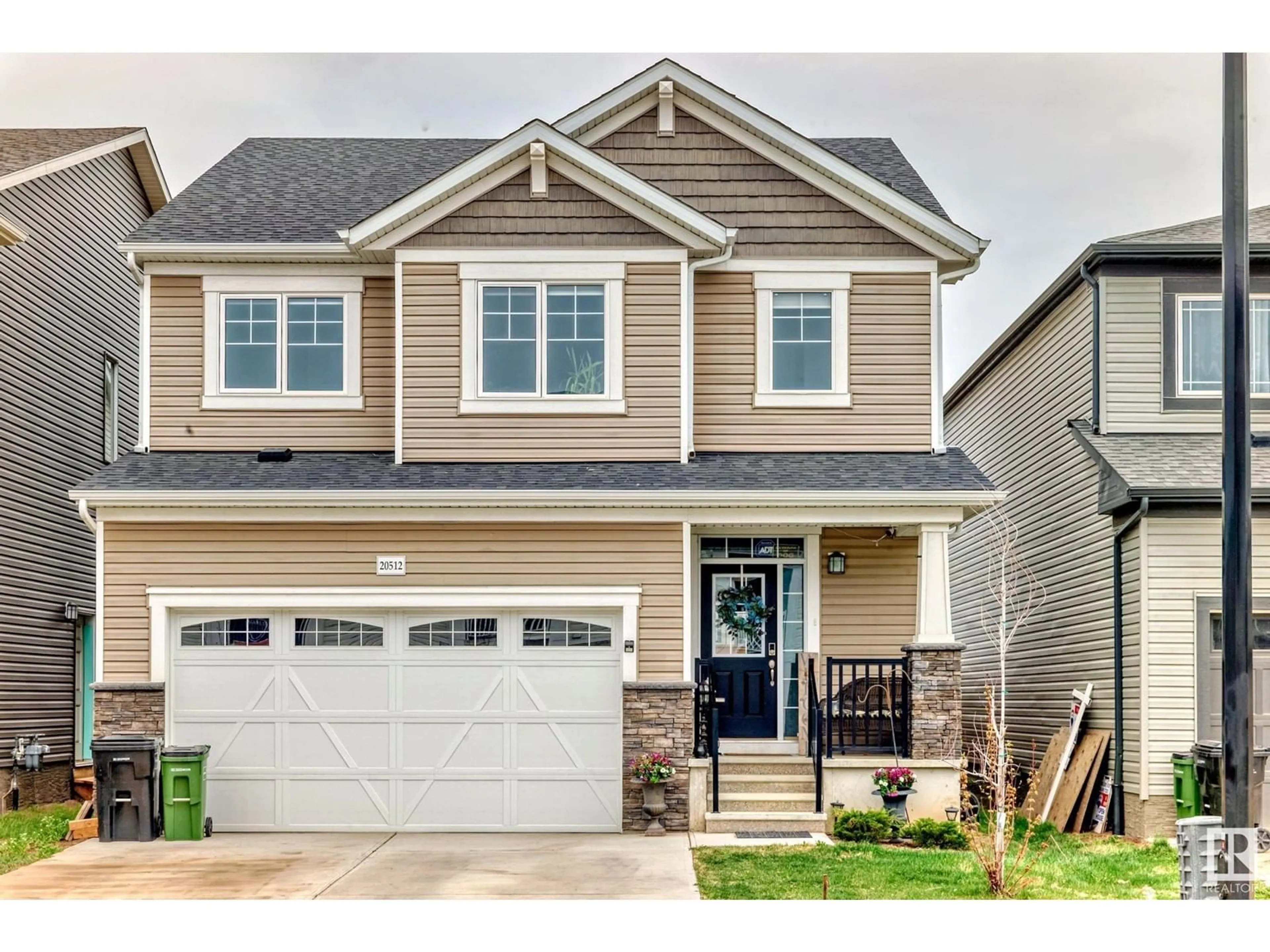 Home with vinyl exterior material, street for 20512 22 AV, Edmonton Alberta T6M1N1