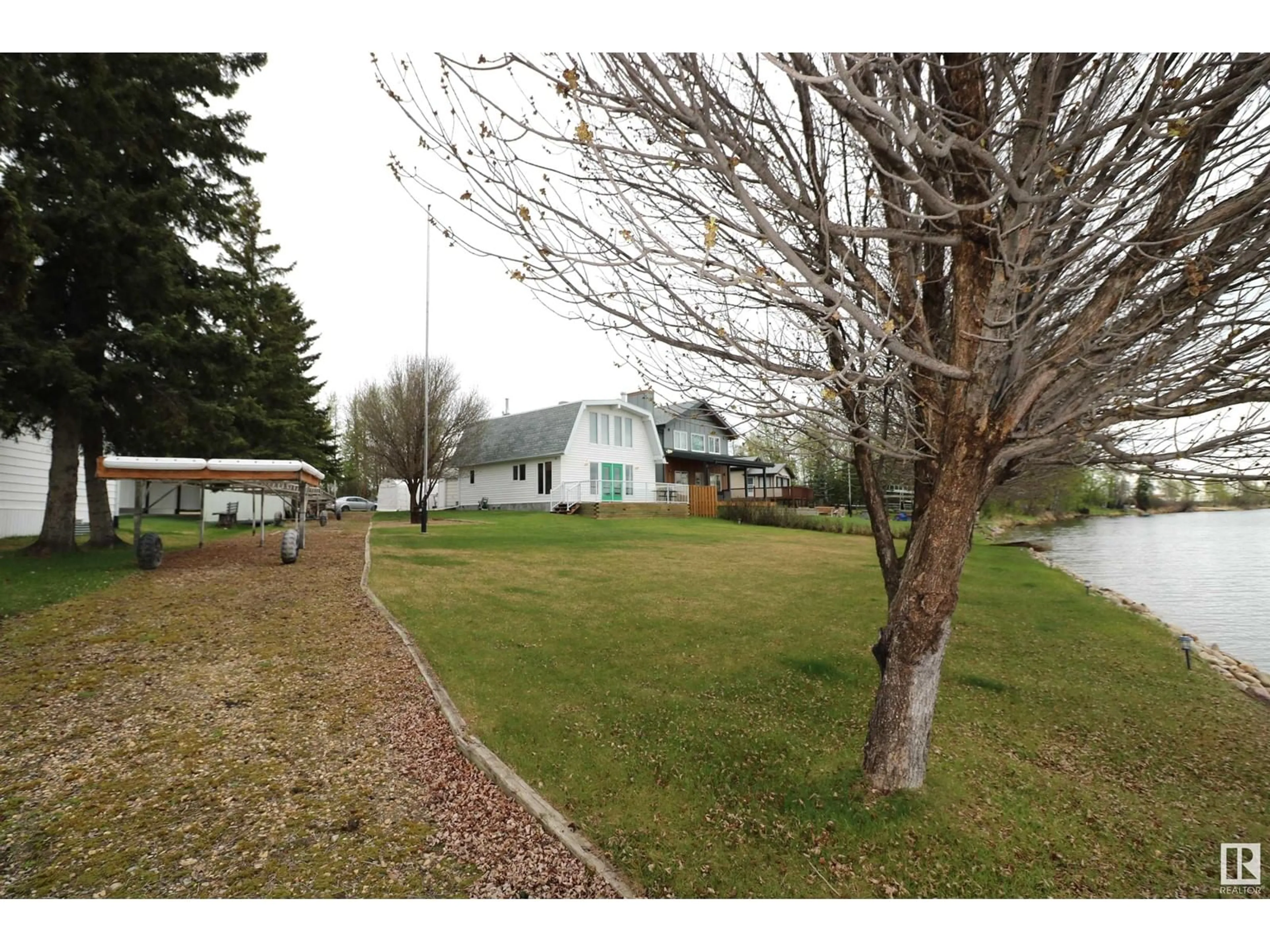 A pic from outside/outdoor area/front of a property/back of a property/a pic from drone, unknown for 217 - 53414 RGE ROAD 62, Rural Lac Ste. Anne County Alberta T0E0T0