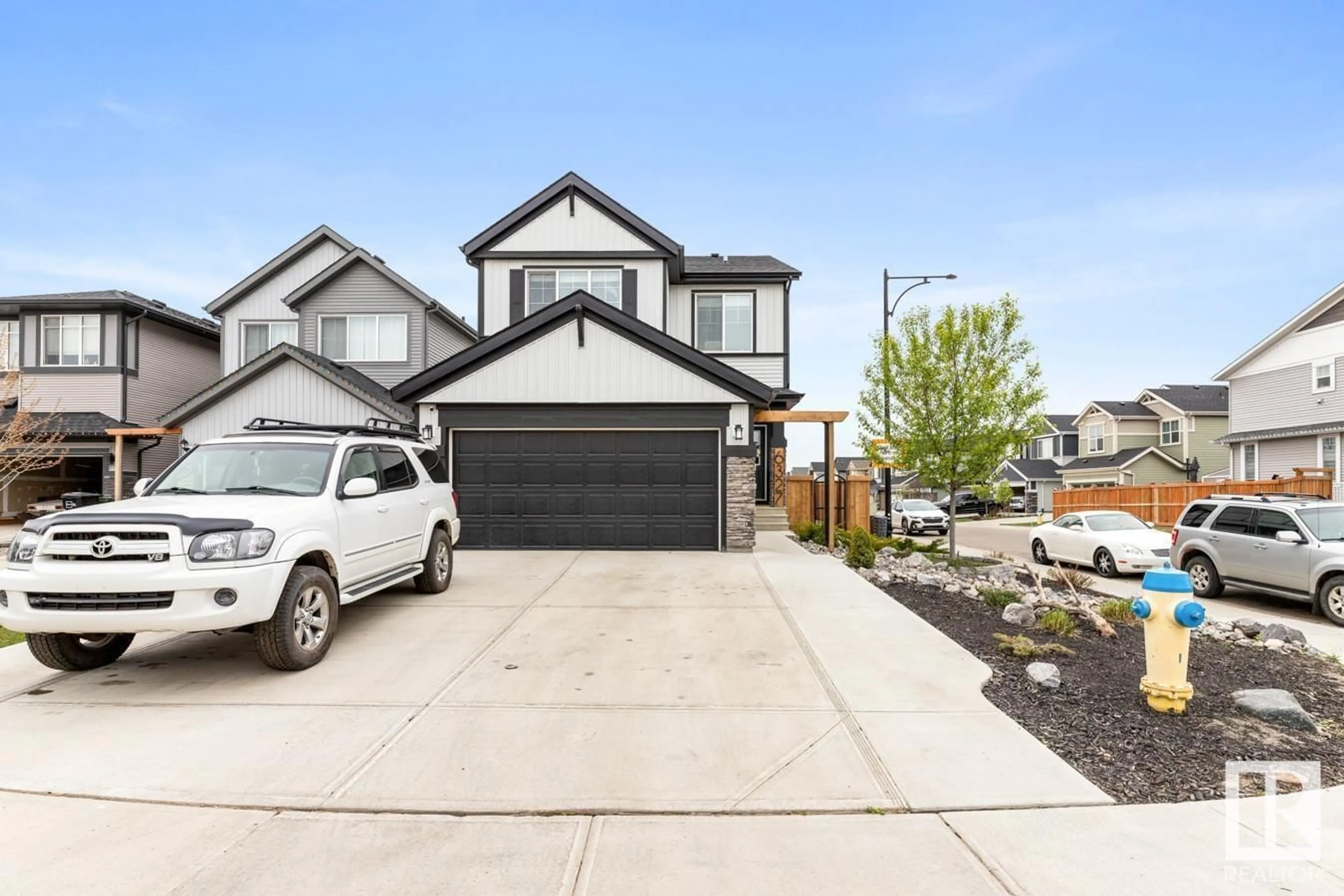 Home with vinyl exterior material, street for 6327 173 AV, Edmonton Alberta T5Y3Y3