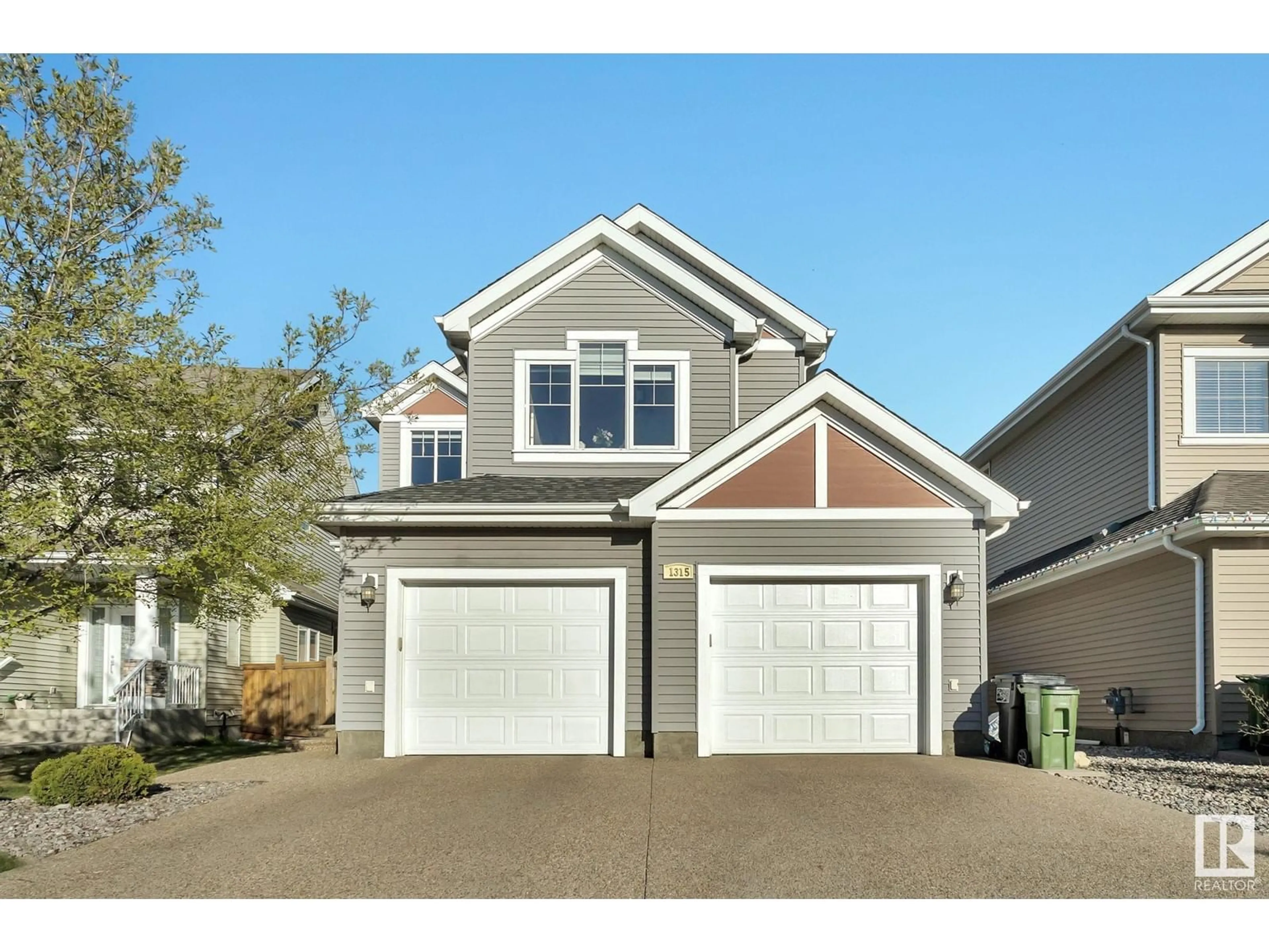 Home with vinyl exterior material, street for 1315 72 ST, Edmonton Alberta T6X0H2