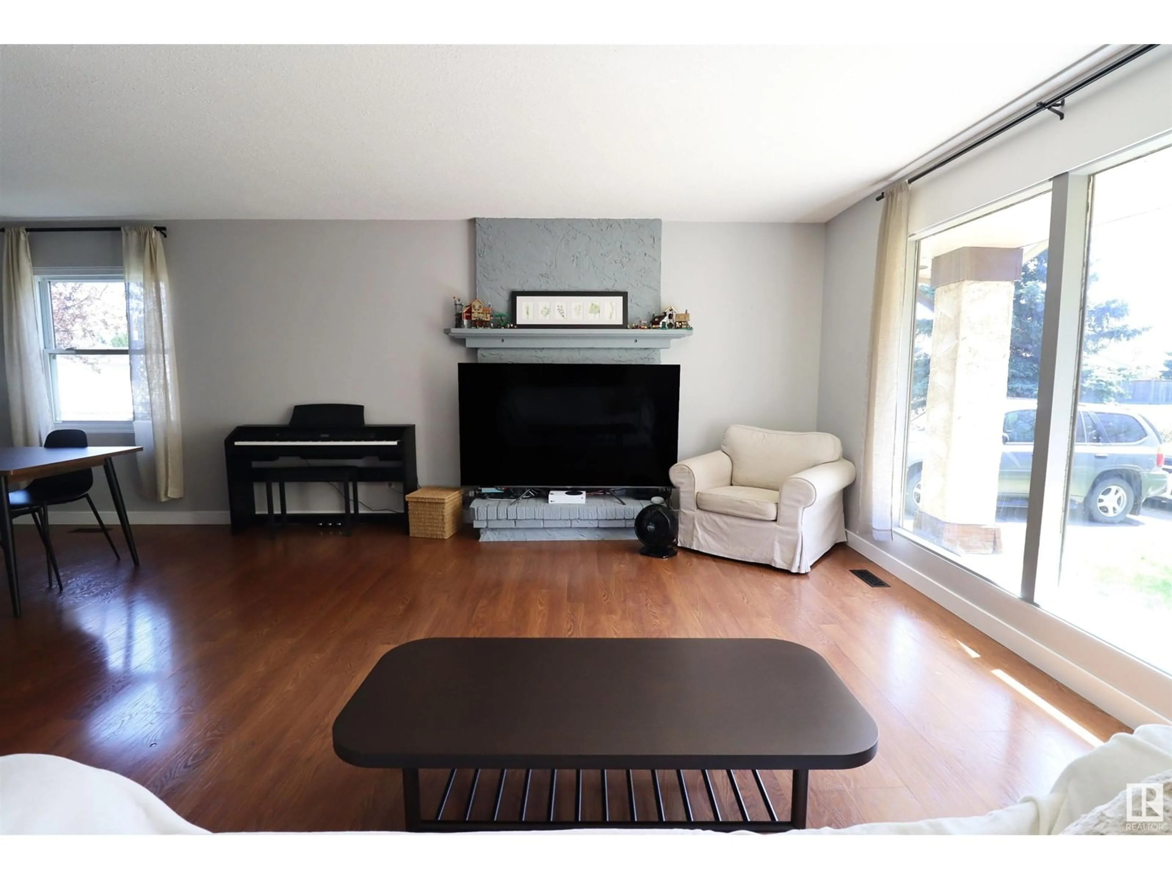 Living room with furniture, wood/laminate floor for 5 OATWAY DR, Stony Plain Alberta T7Z1E9