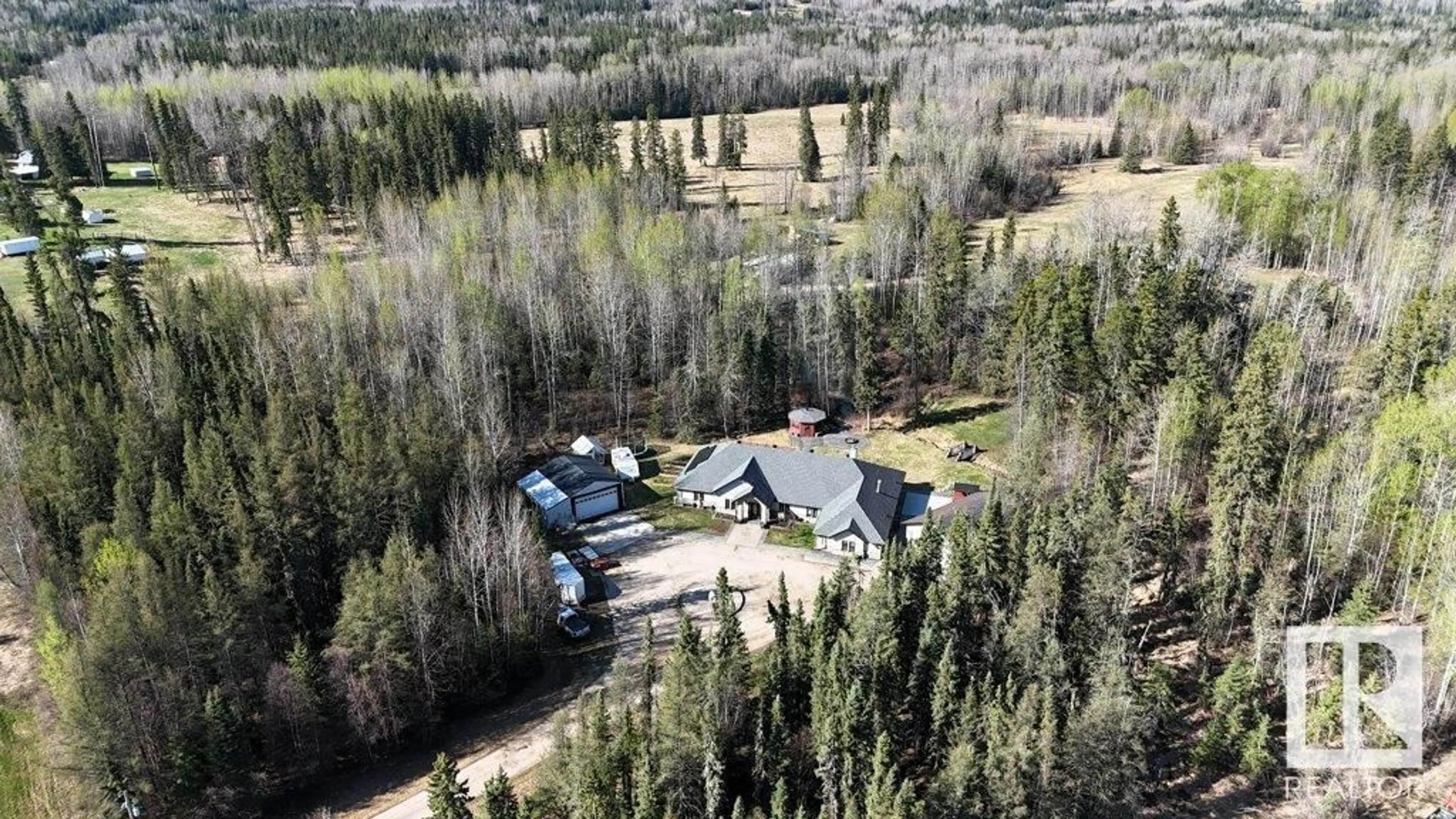 A pic from outside/outdoor area/front of a property/back of a property/a pic from drone, unknown for 590072 RGE RD 113 A, Rural Woodlands County Alberta T7S1P8