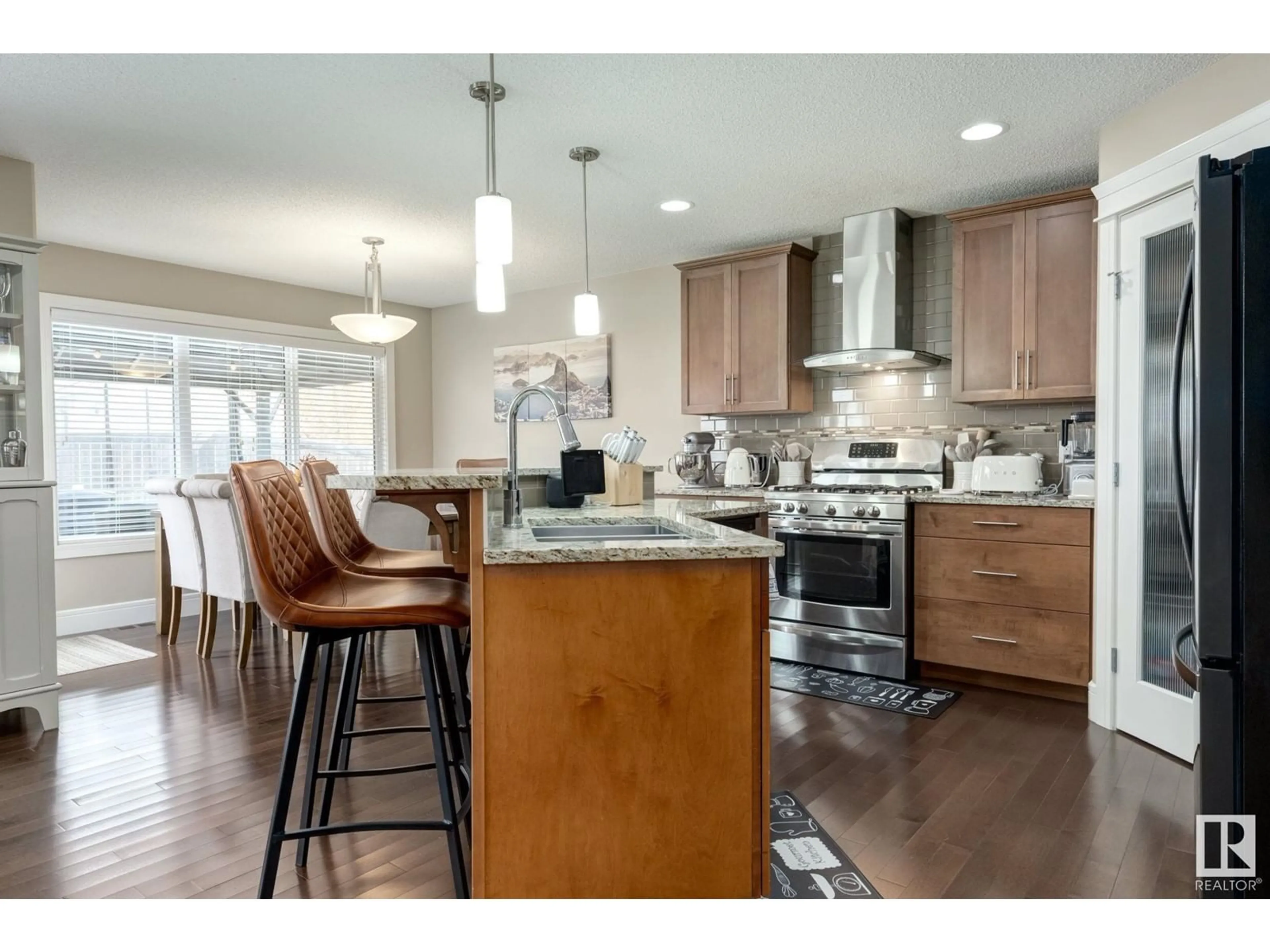 Open concept kitchen, wood/laminate floor for SW - 17814 6A AV, Edmonton Alberta T6W2L6