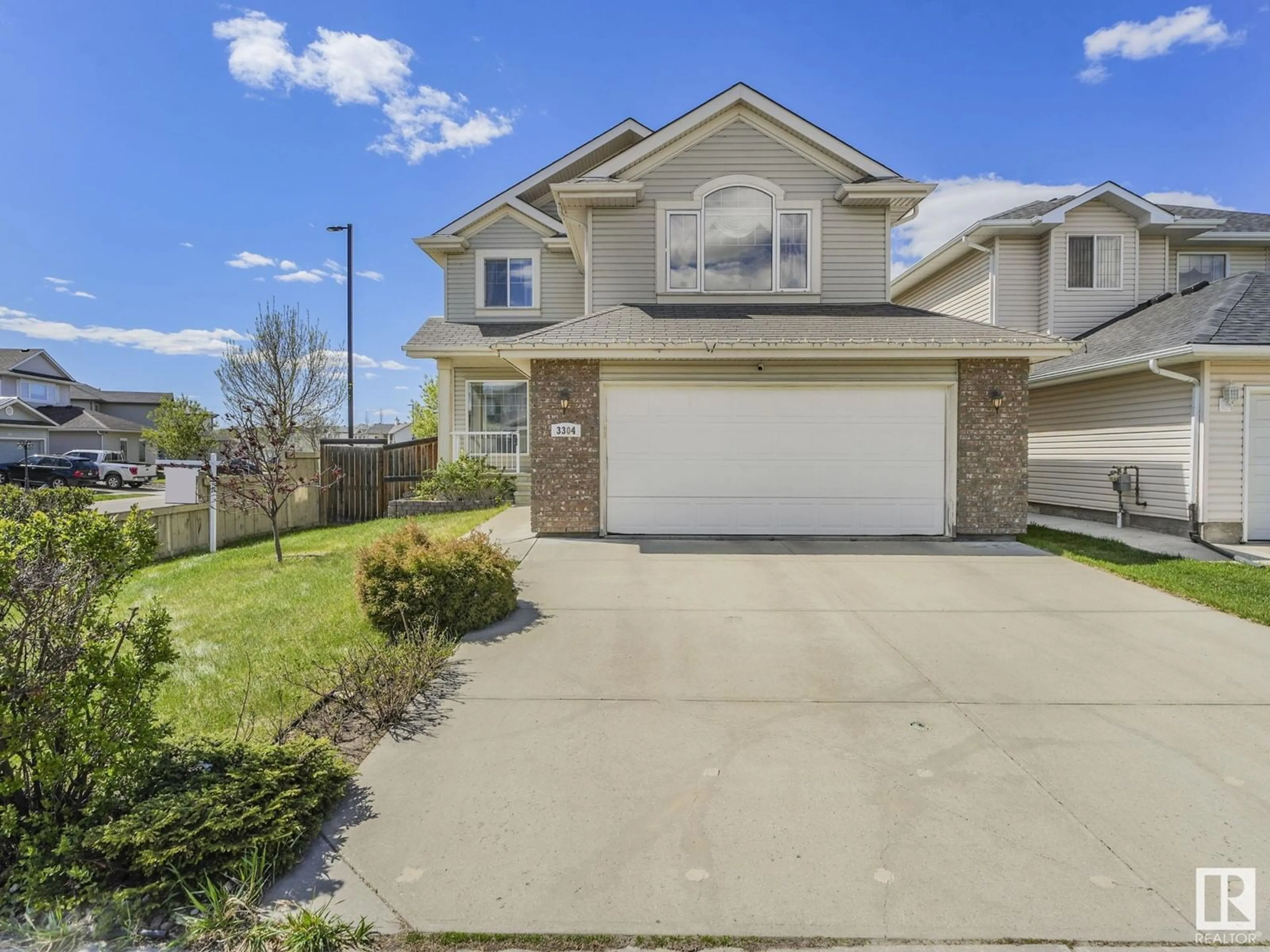 Home with vinyl exterior material, street for NW - 3304 23 ST, Edmonton Alberta T6T0A7