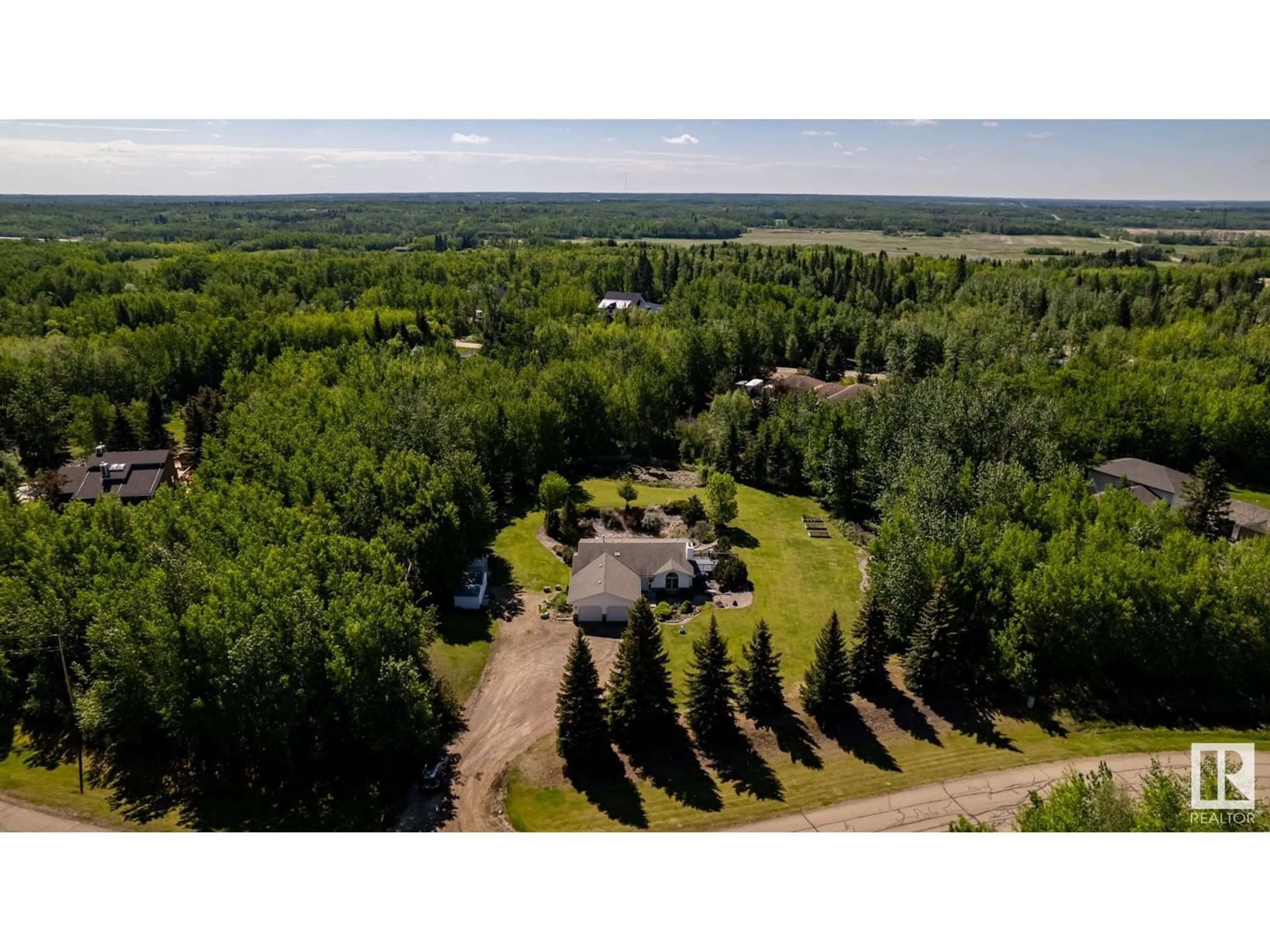 A pic from outside/outdoor area/front of a property/back of a property/a pic from drone, forest/trees view for 52225 - 194 RGE ROAD 232, Rural Strathcona County Alberta T8B1L5