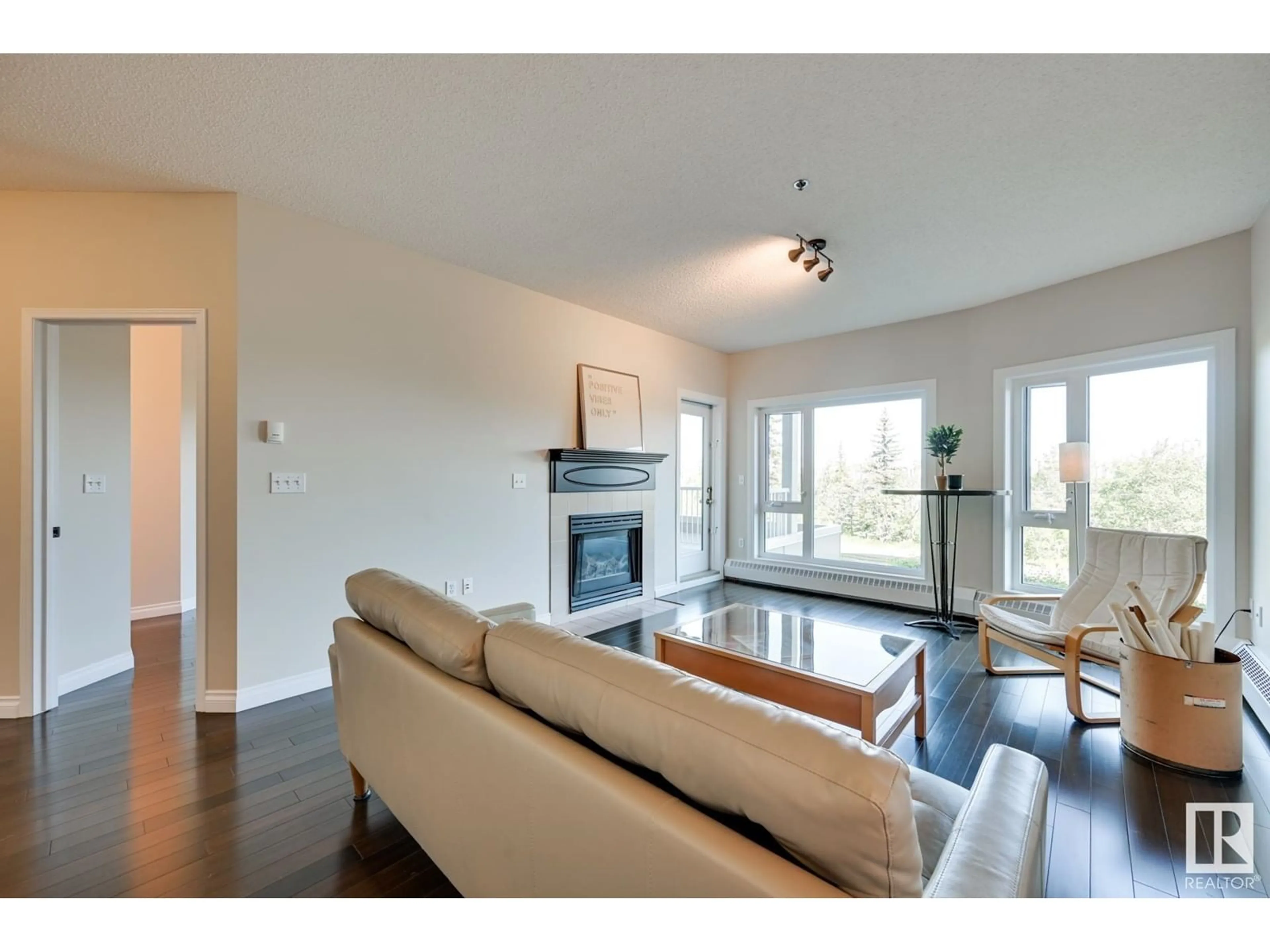 Living room with furniture, wood/laminate floor for 202 - 10809 SASKATCHEWAN DR, Edmonton Alberta T6E4S5