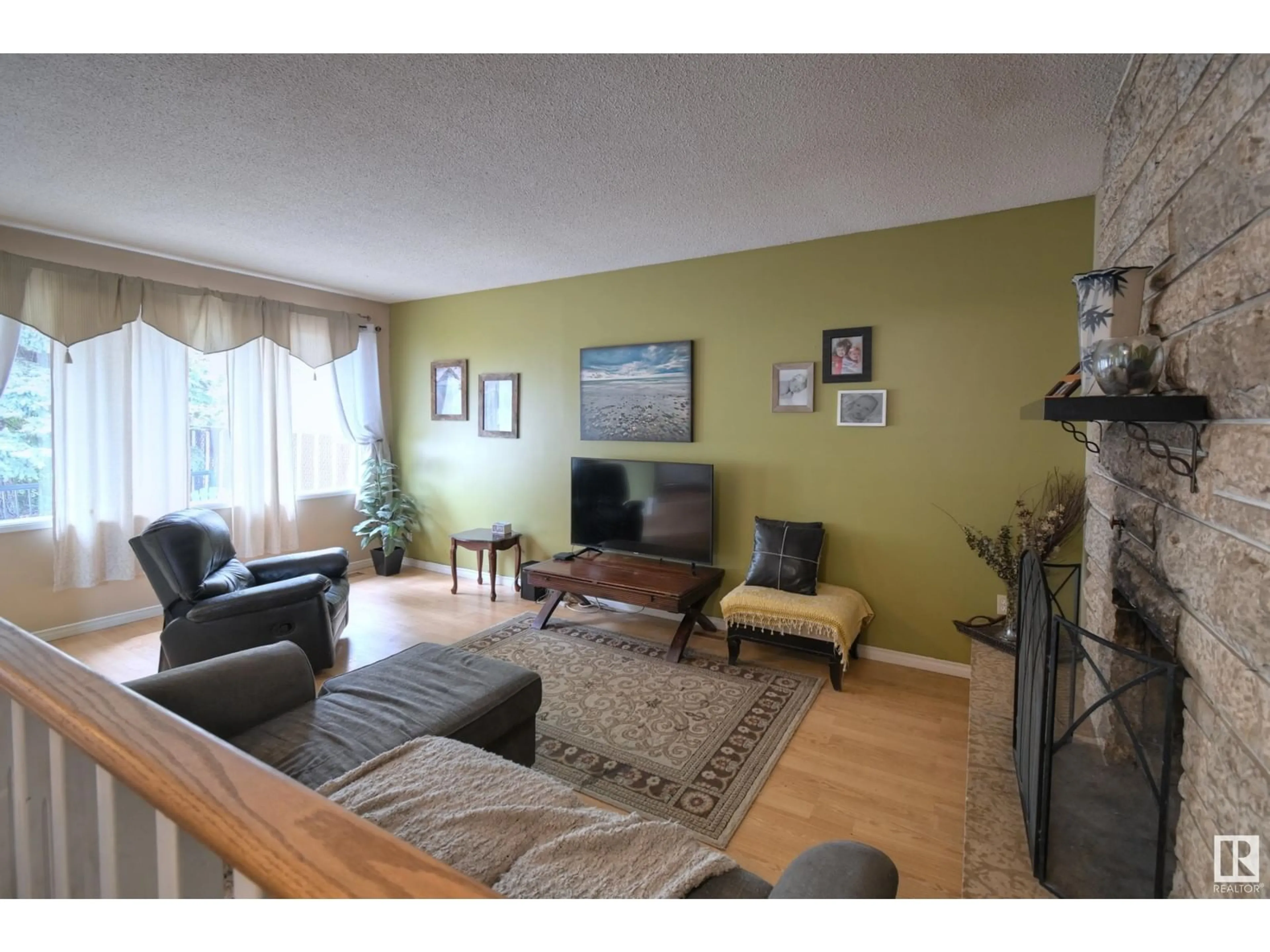 Living room with furniture, wood/laminate floor for 29 BEECHMONT CR, Spruce Grove Alberta T7X1E8