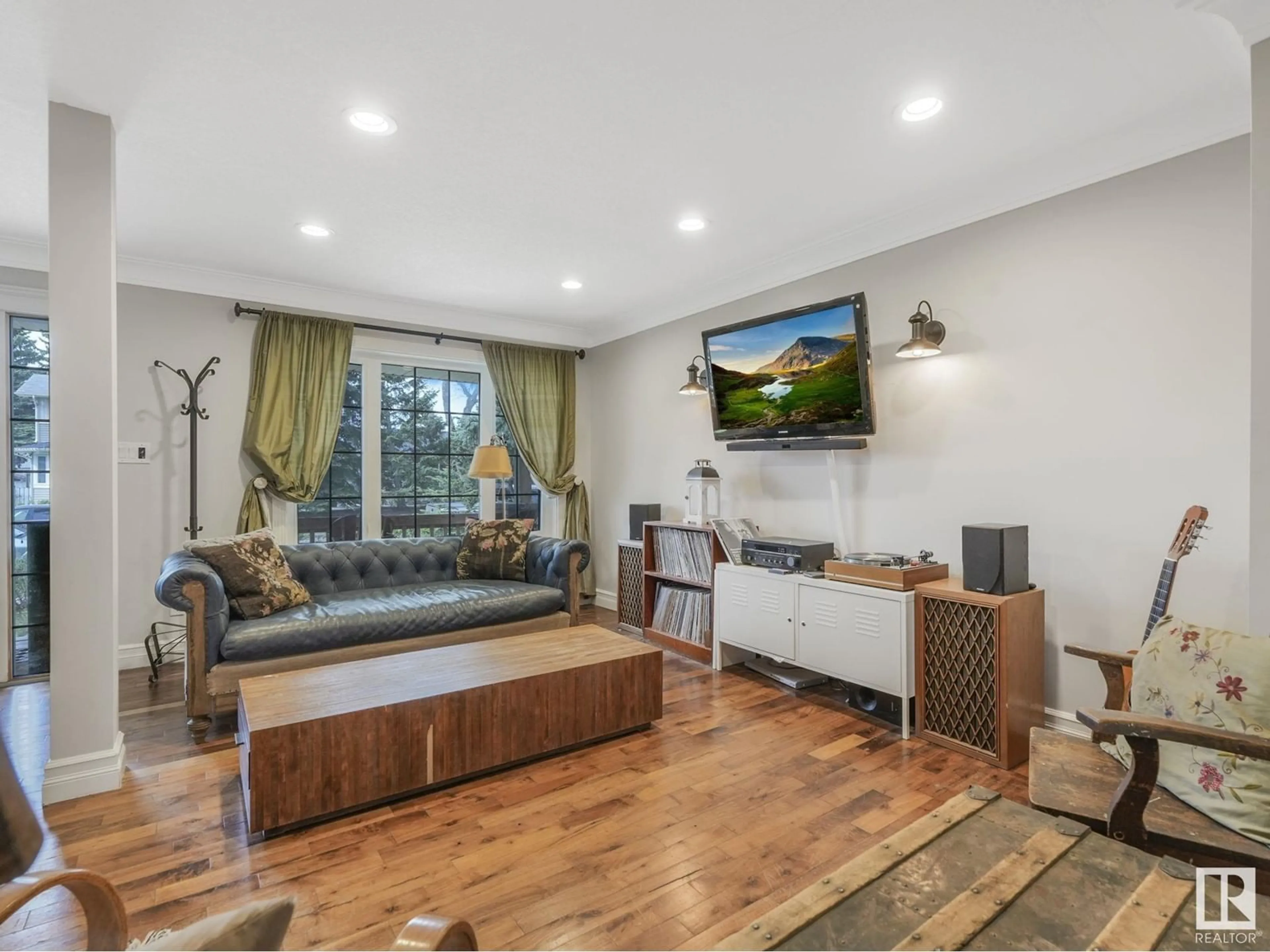 Living room with furniture, wood/laminate floor for NW - 8724 92B AV, Edmonton Alberta T6C1S9