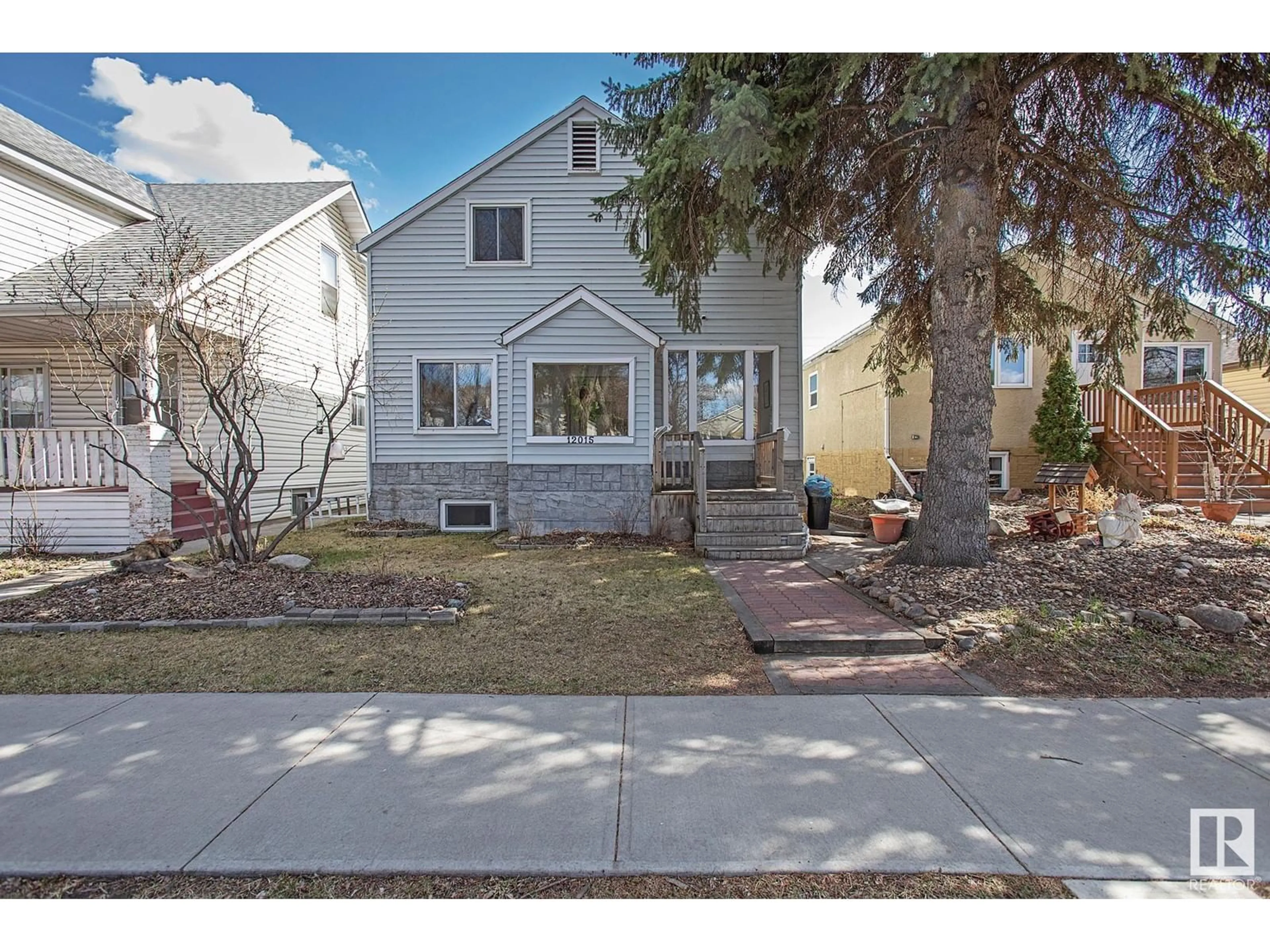 Home with vinyl exterior material, street for 12015 62 ST, Edmonton Alberta T5W4C9