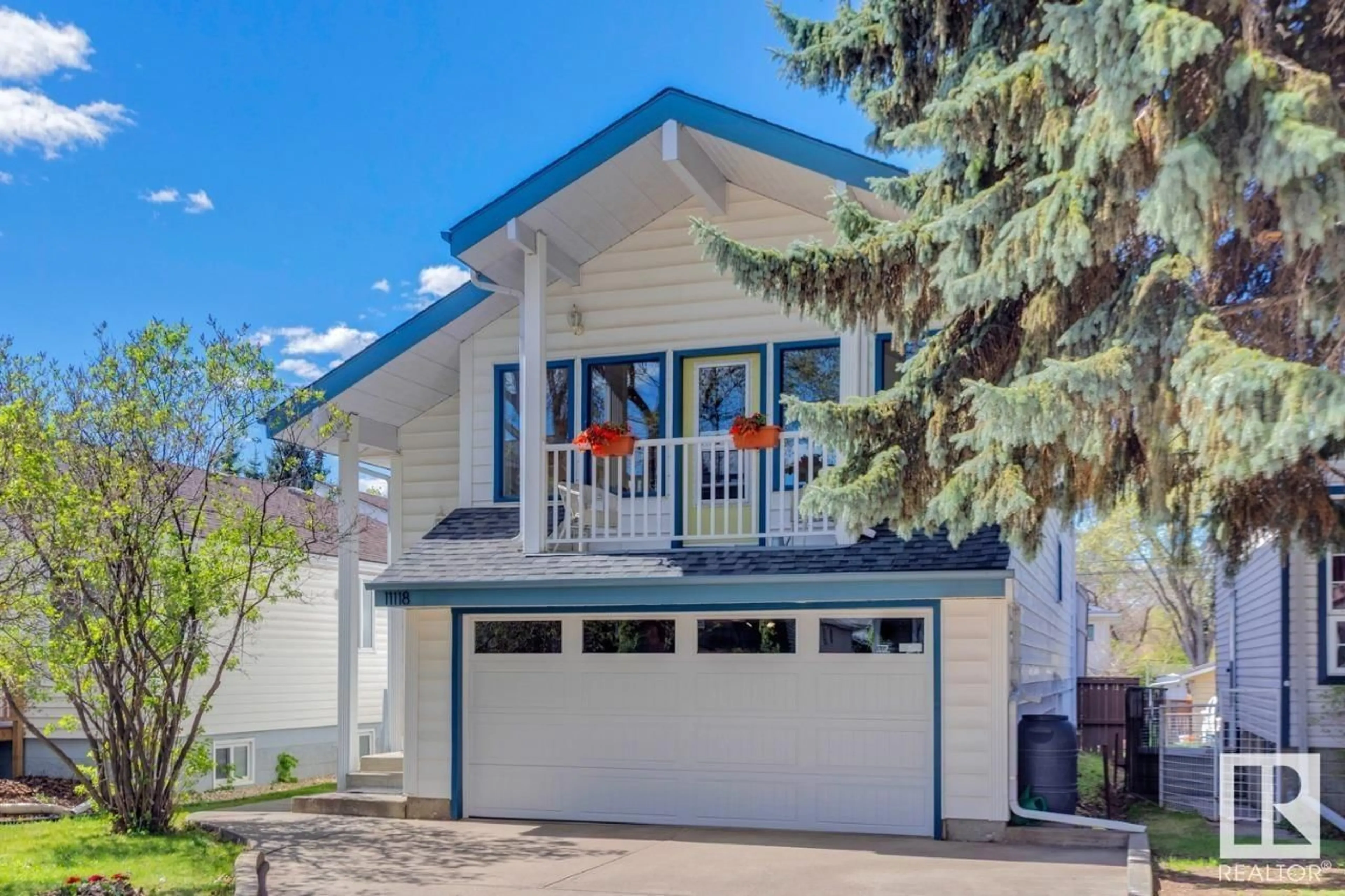 Home with vinyl exterior material, street for 11118 52 ST, Edmonton Alberta T5W3H7