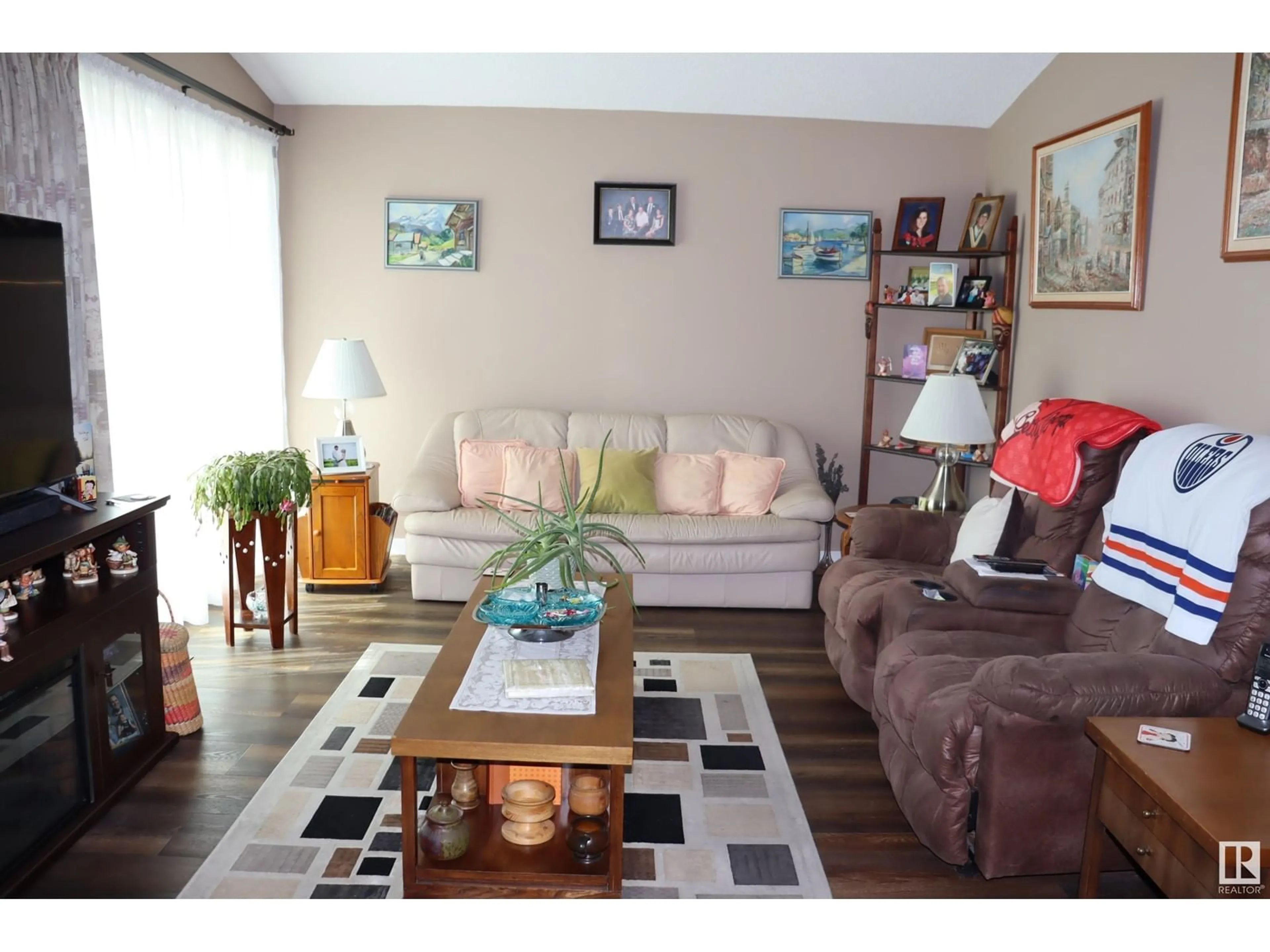 Living room with furniture, wood/laminate floor for 5408 50 AVE, Wetaskiwin Alberta T9A0T2