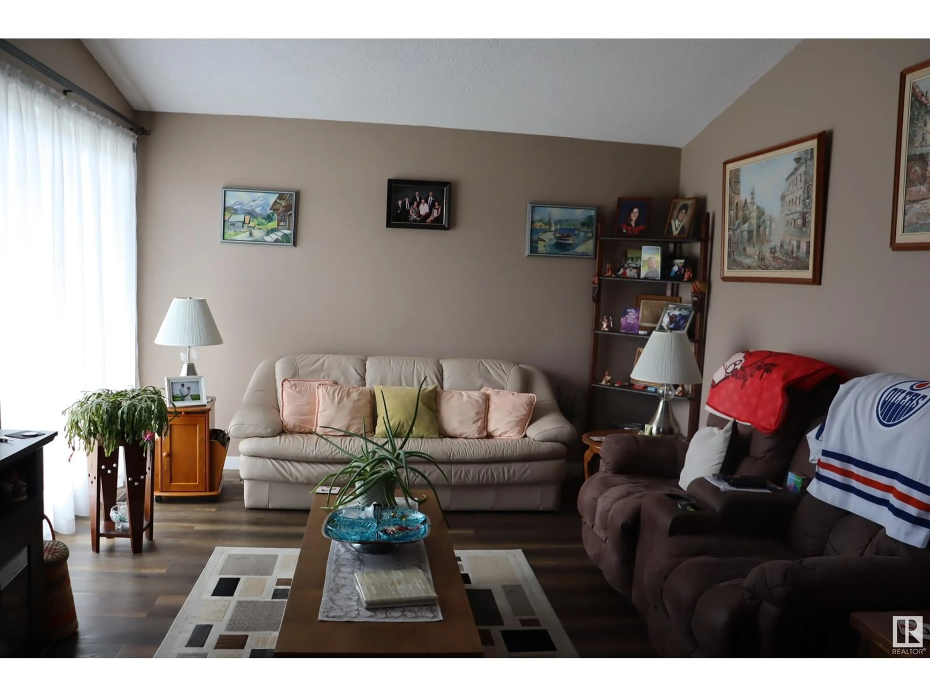 Living room with furniture, wood/laminate floor for 5408 50 AVE, Wetaskiwin Alberta T9A0T2