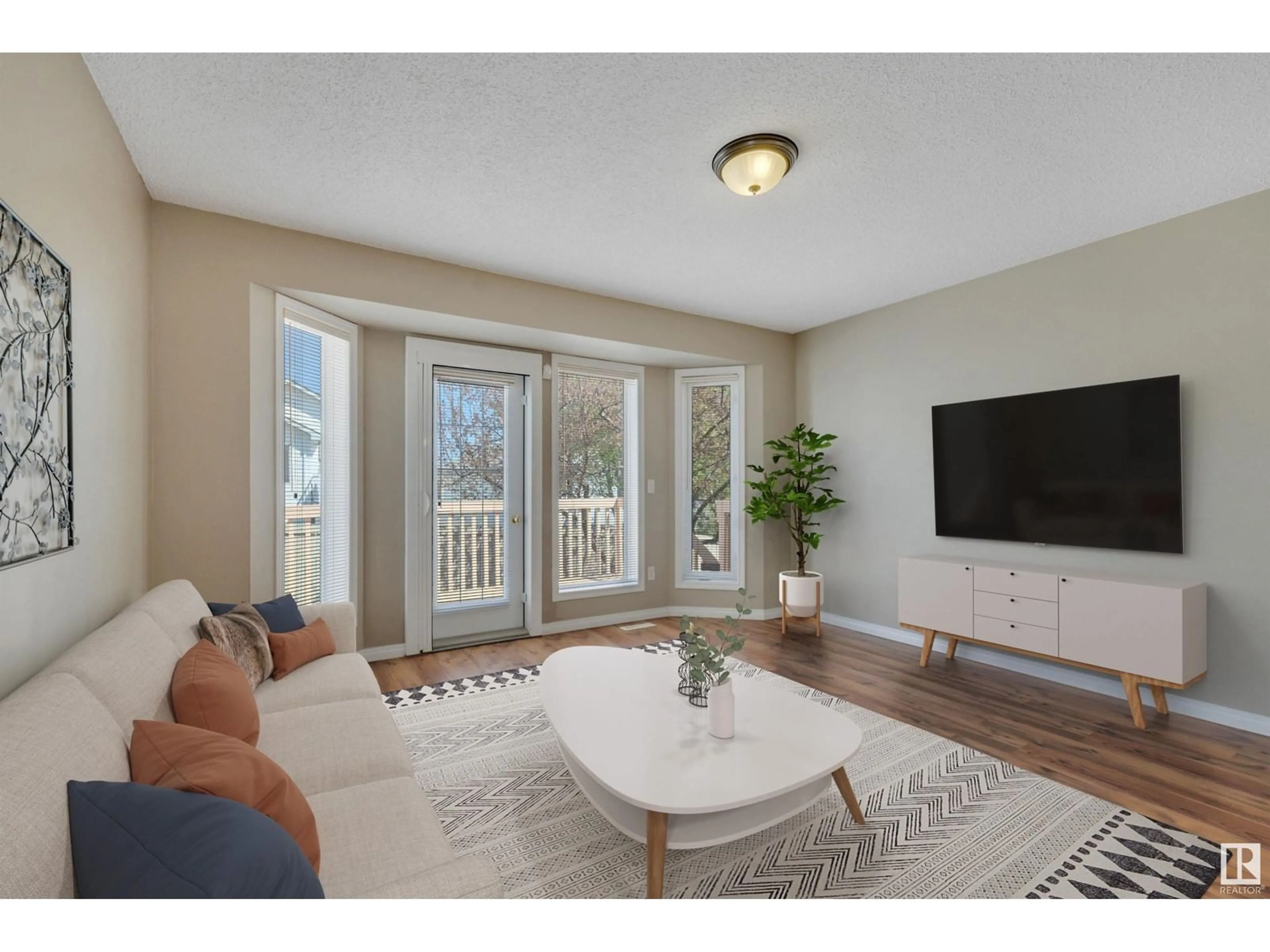Living room with furniture, wood/laminate floor for 43 14428 MILLER BV NW, Edmonton Alberta T5Y2Y6