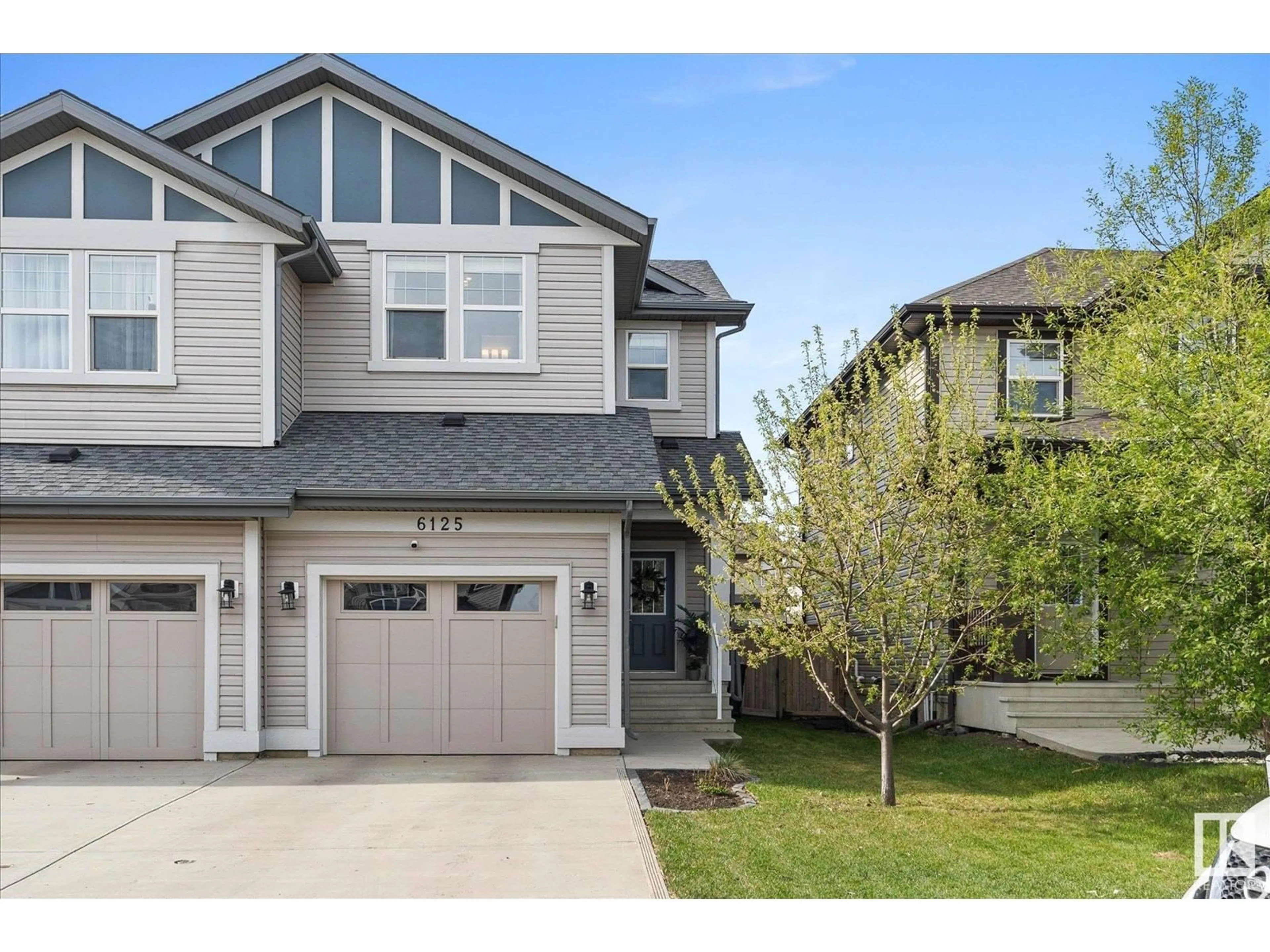 Home with vinyl exterior material, street for 6125 176 AV, Edmonton Alberta T5Y3P1