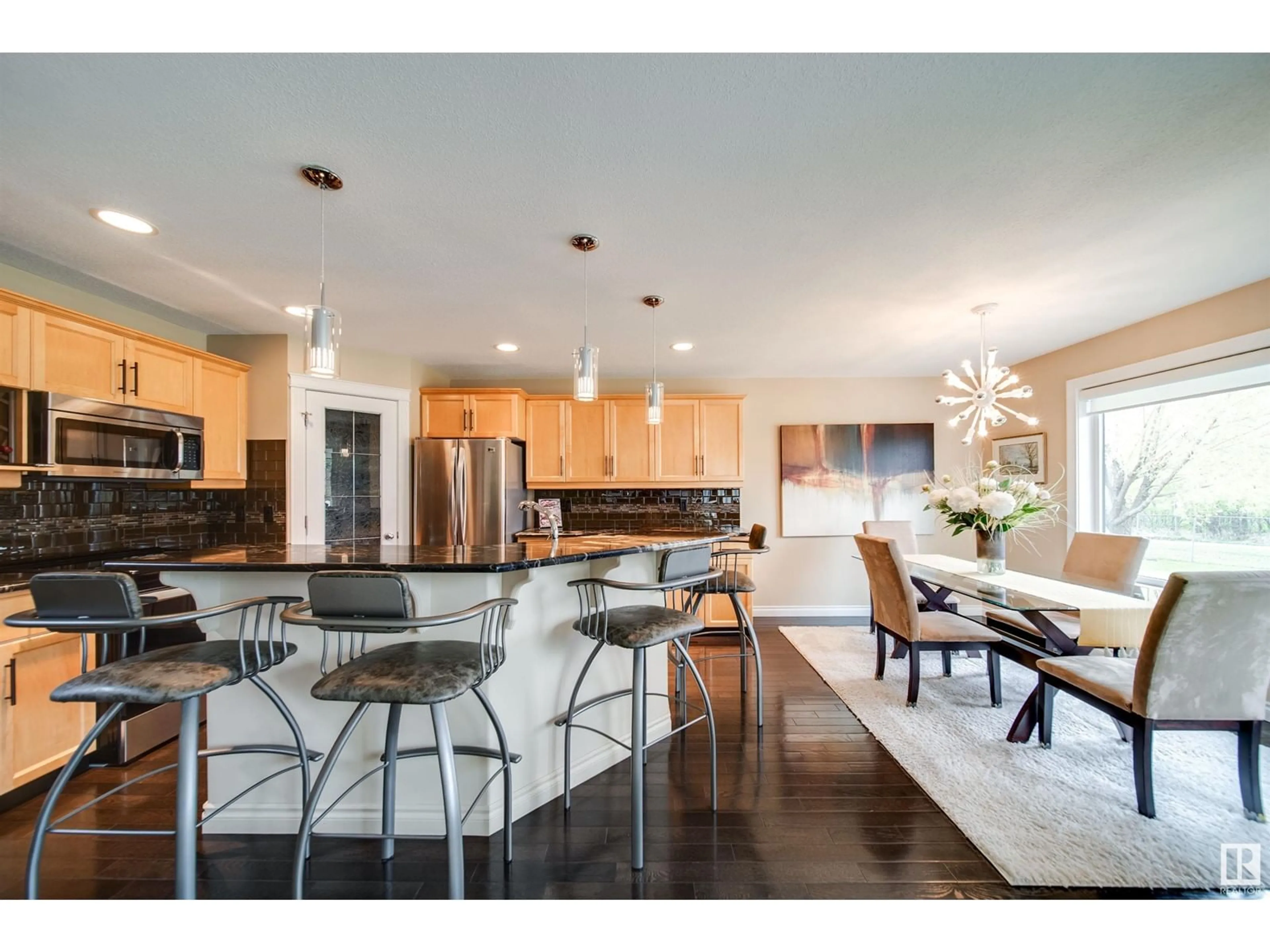 Open concept kitchen, wood/laminate floor for 18 211 BLACKBURN E SW, Edmonton Alberta T6W1C8