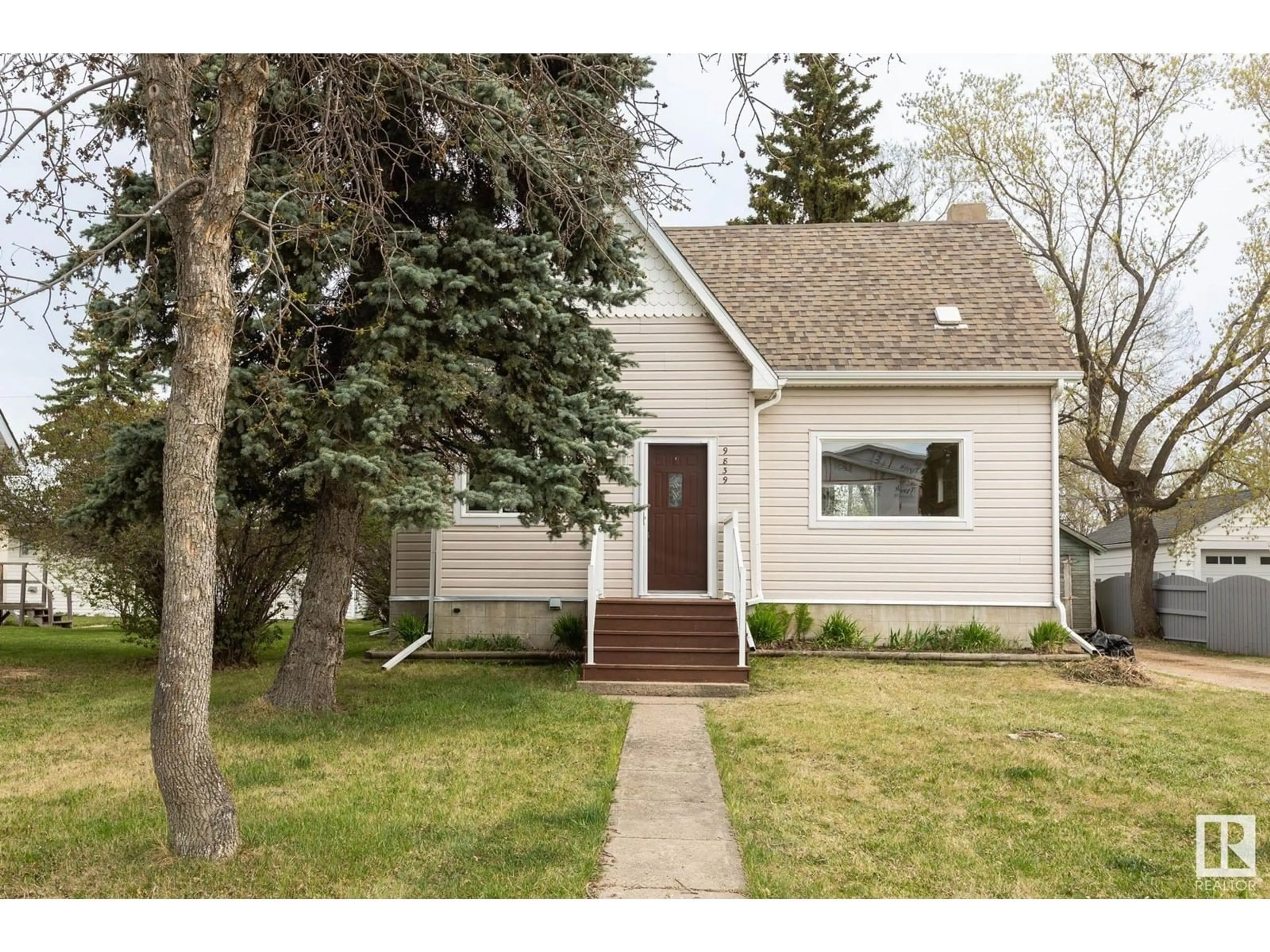 Home with vinyl exterior material, street for 9839 105 ST, Westlock Alberta T7P1S8
