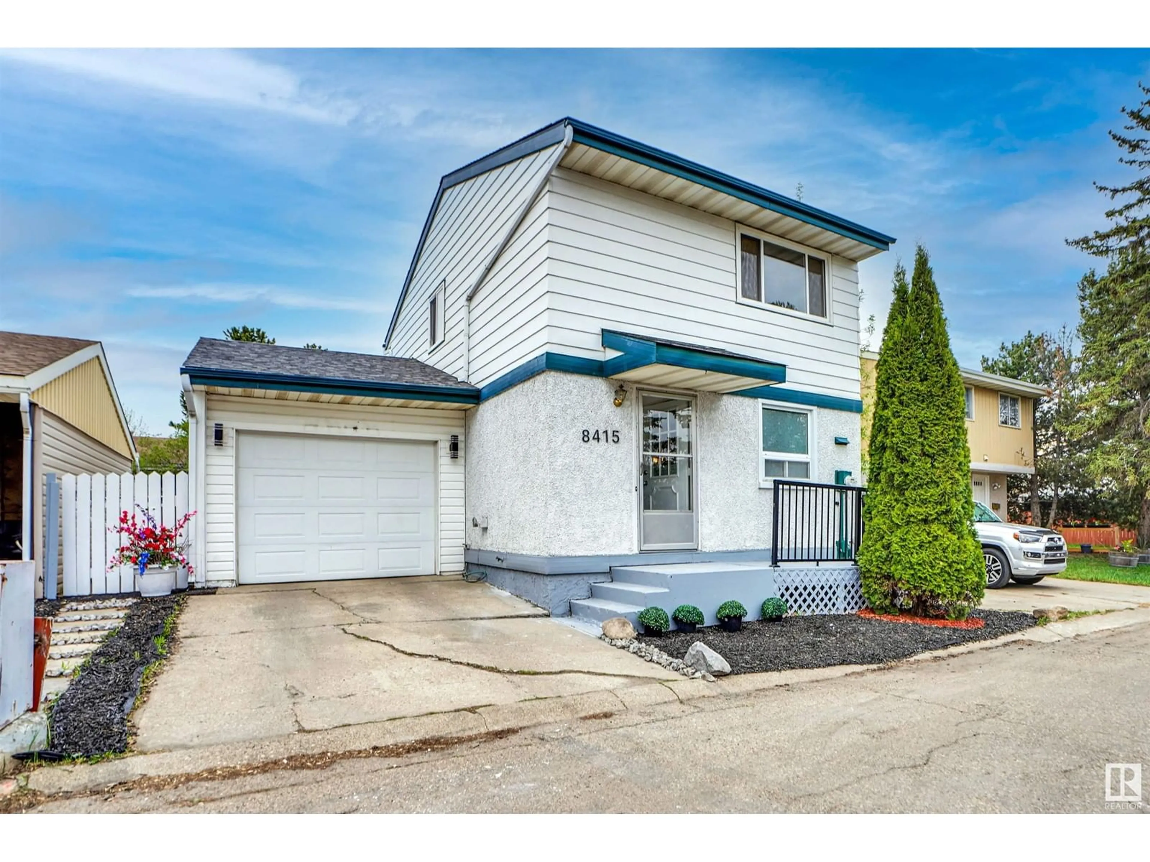 Home with vinyl exterior material, street for 8415 MILL WOODS RD NW, Edmonton Alberta T6K2P6