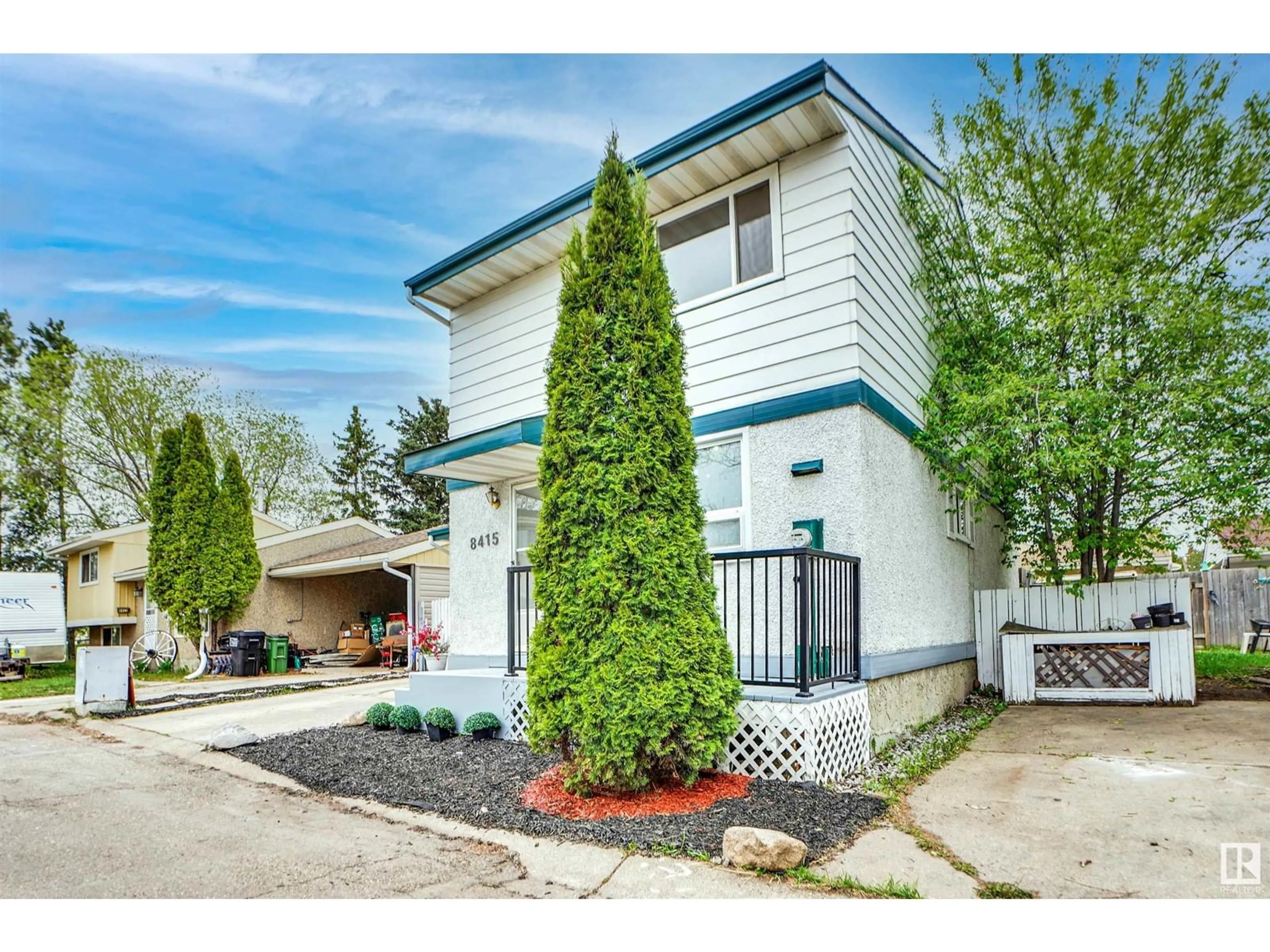 Home with vinyl exterior material, street for 8415 MILL WOODS RD NW, Edmonton Alberta T6K2P6
