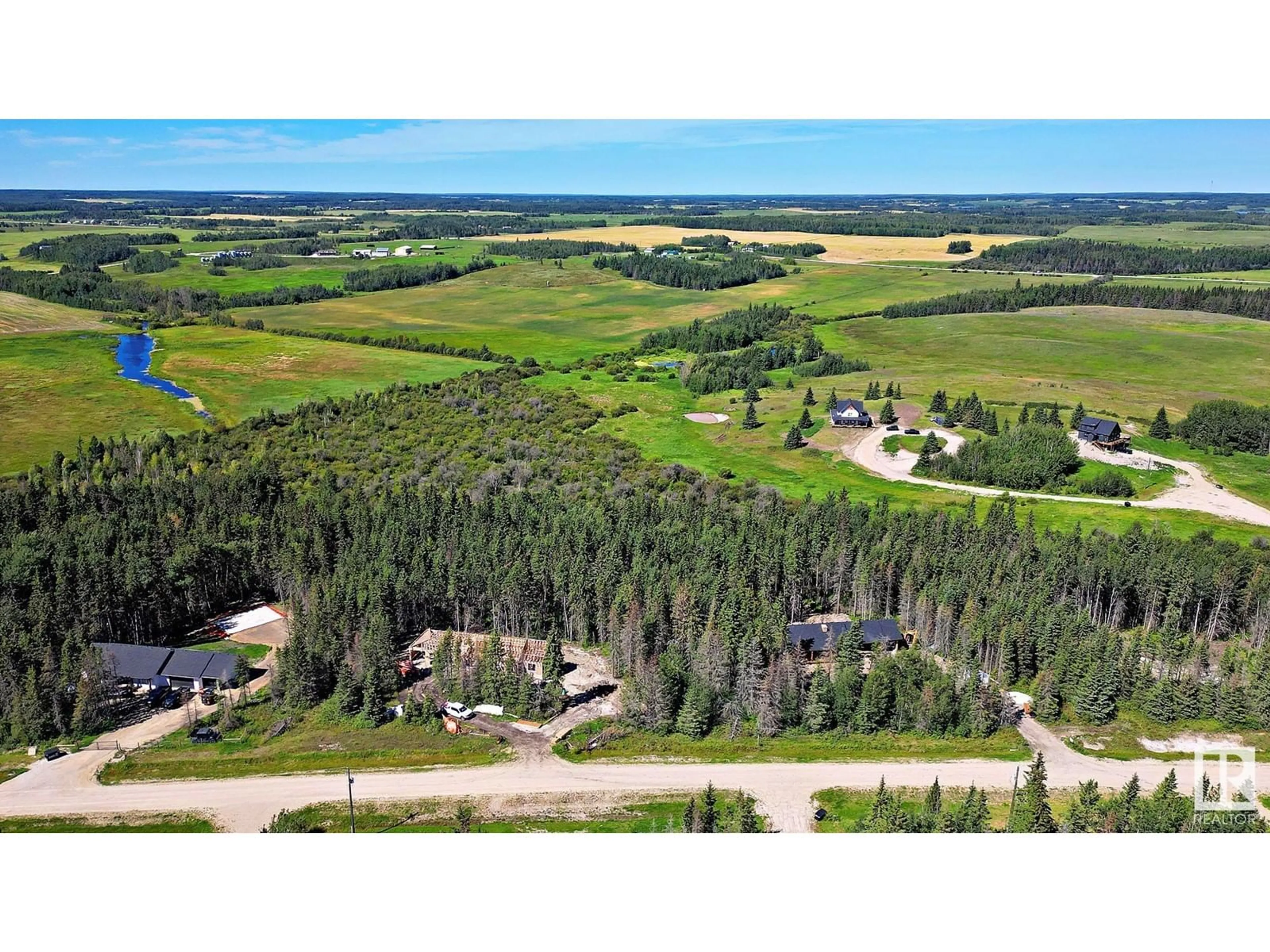 A pic from outside/outdoor area/front of a property/back of a property/a pic from drone, forest/trees view for 311 55504 RR 13, Rural Lac Ste. Anne County Alberta T0E1V0
