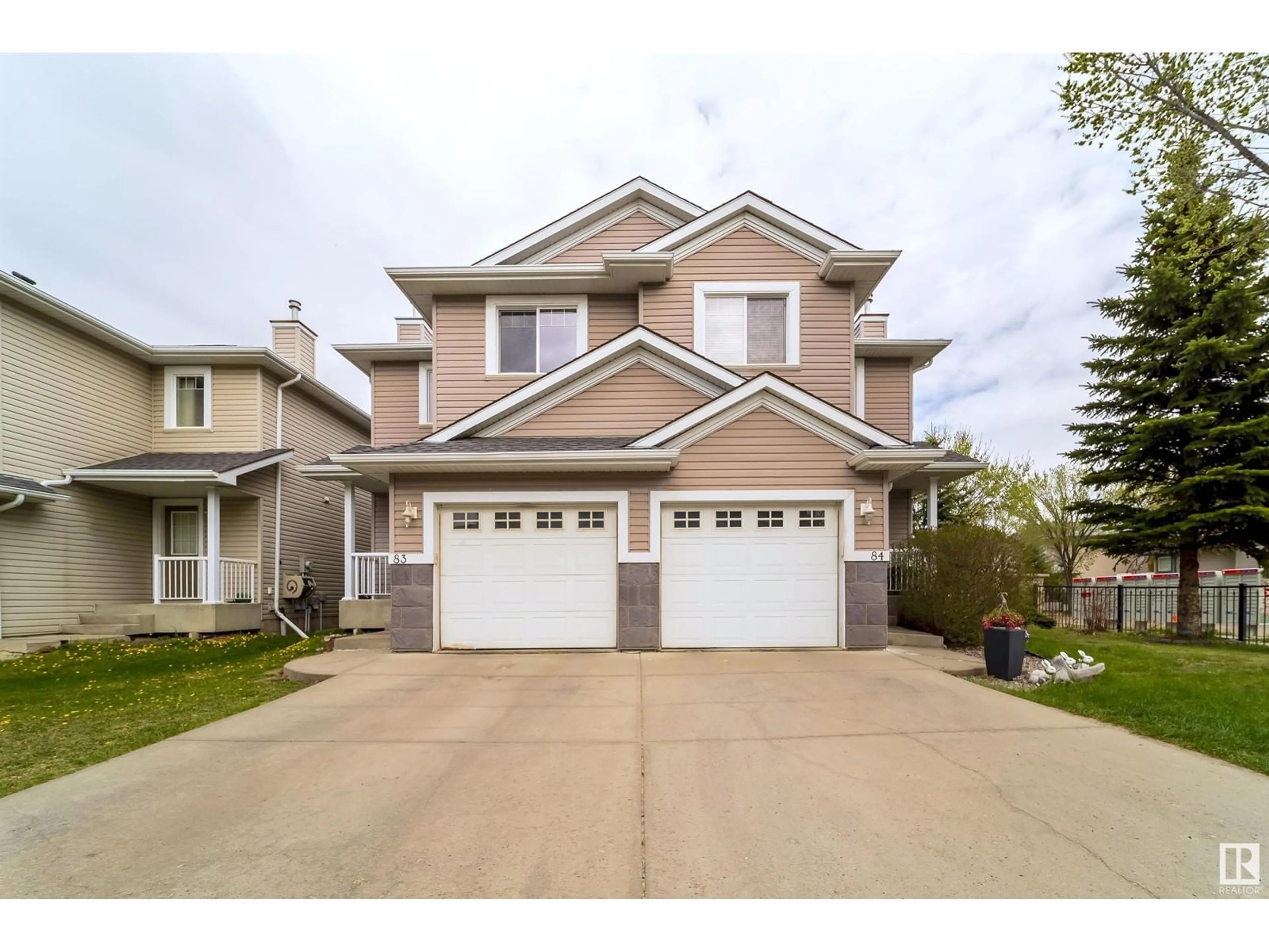 Home with vinyl exterior material, street for #83 - 1428 HODGSON WY, Edmonton Alberta T6R3P8