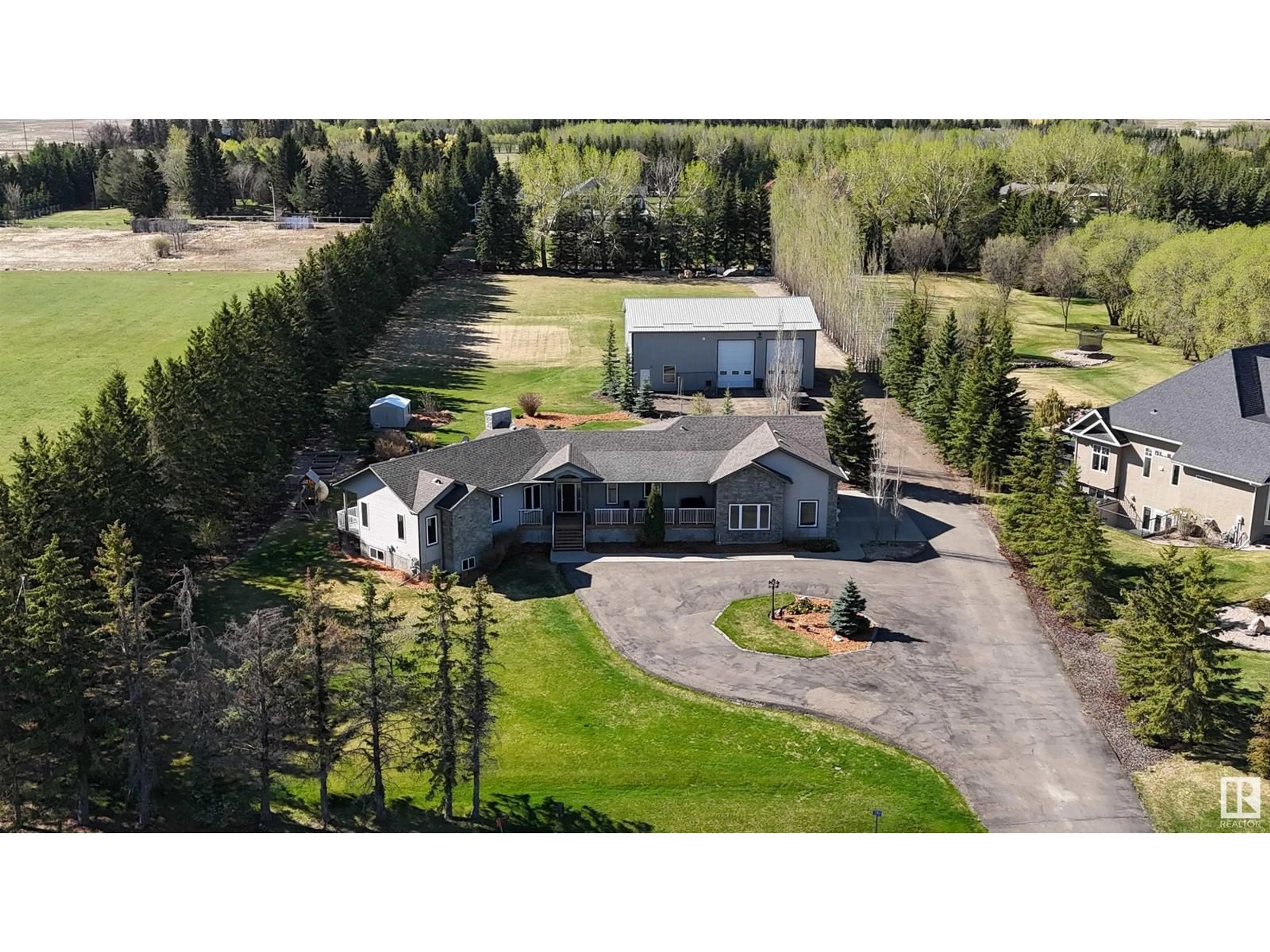 A pic from outside/outdoor area/front of a property/back of a property/a pic from drone, unknown for 380 50512 RGE ROAD 245, Rural Leduc County Alberta T4X0P5