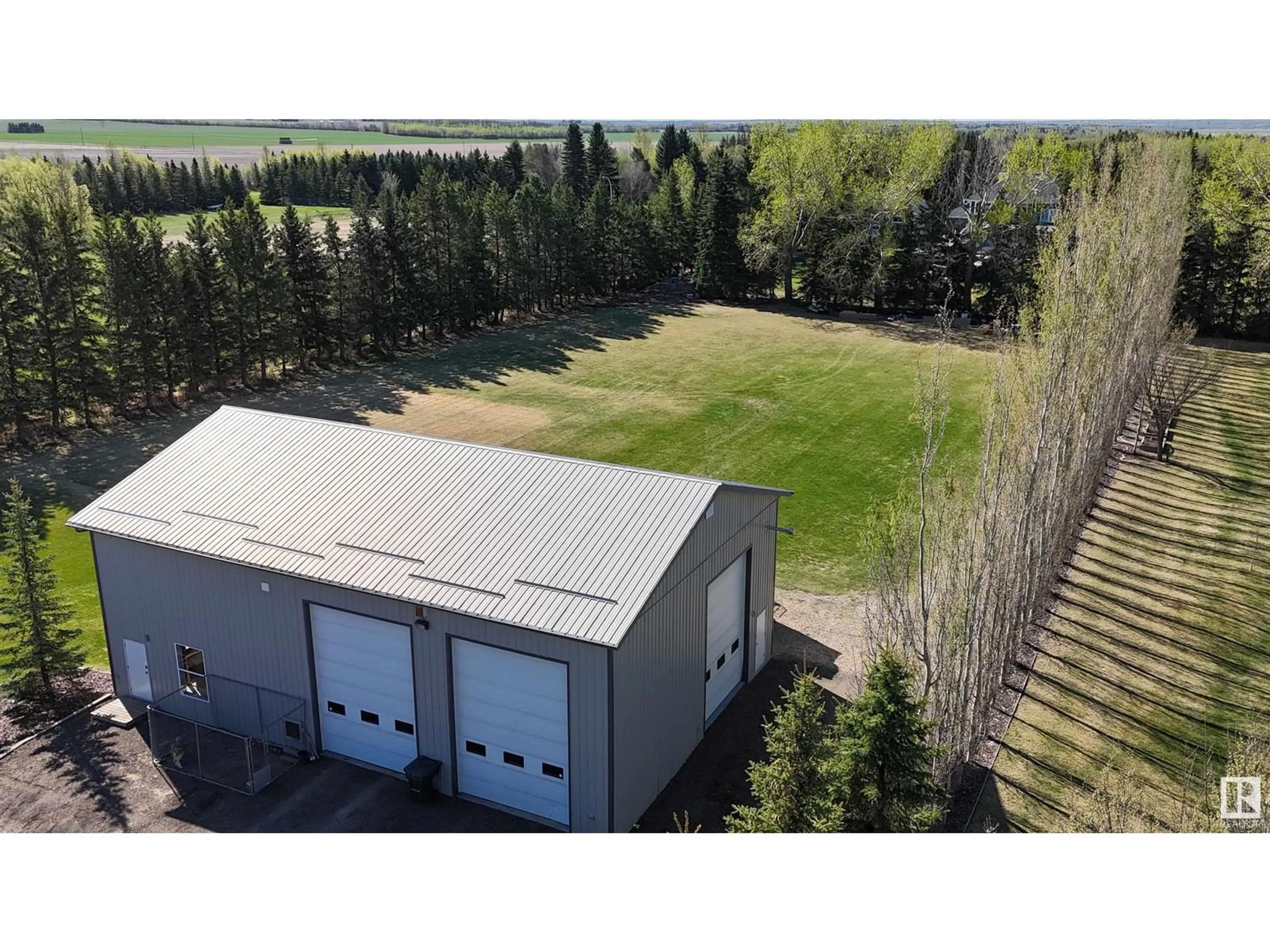 A pic from outside/outdoor area/front of a property/back of a property/a pic from drone, building for 380 50512 RGE ROAD 245, Rural Leduc County Alberta T4X0P5