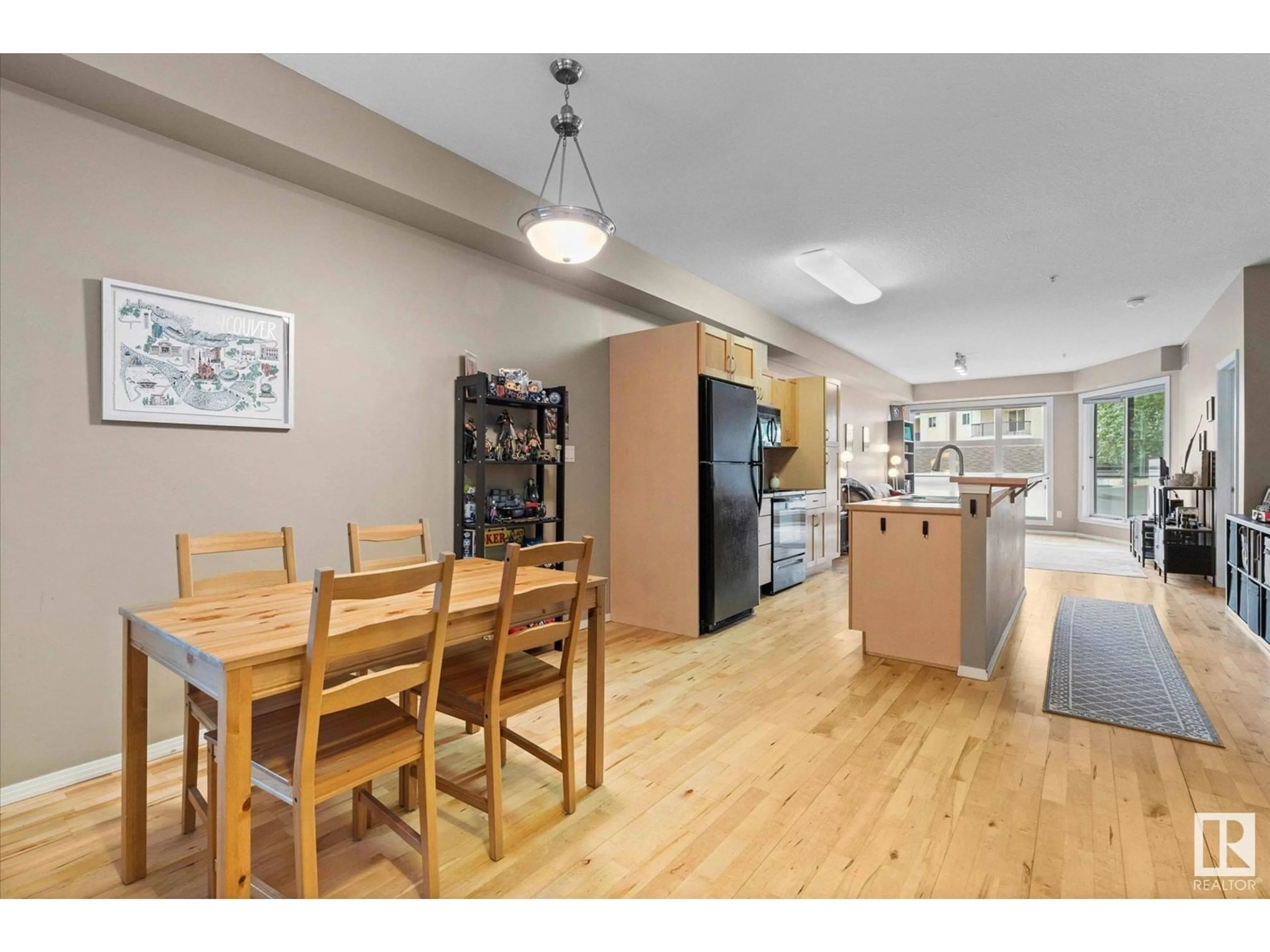Open concept kitchen, wood/laminate floor for #107 - 11933 106 AV, Edmonton Alberta T5H0S2