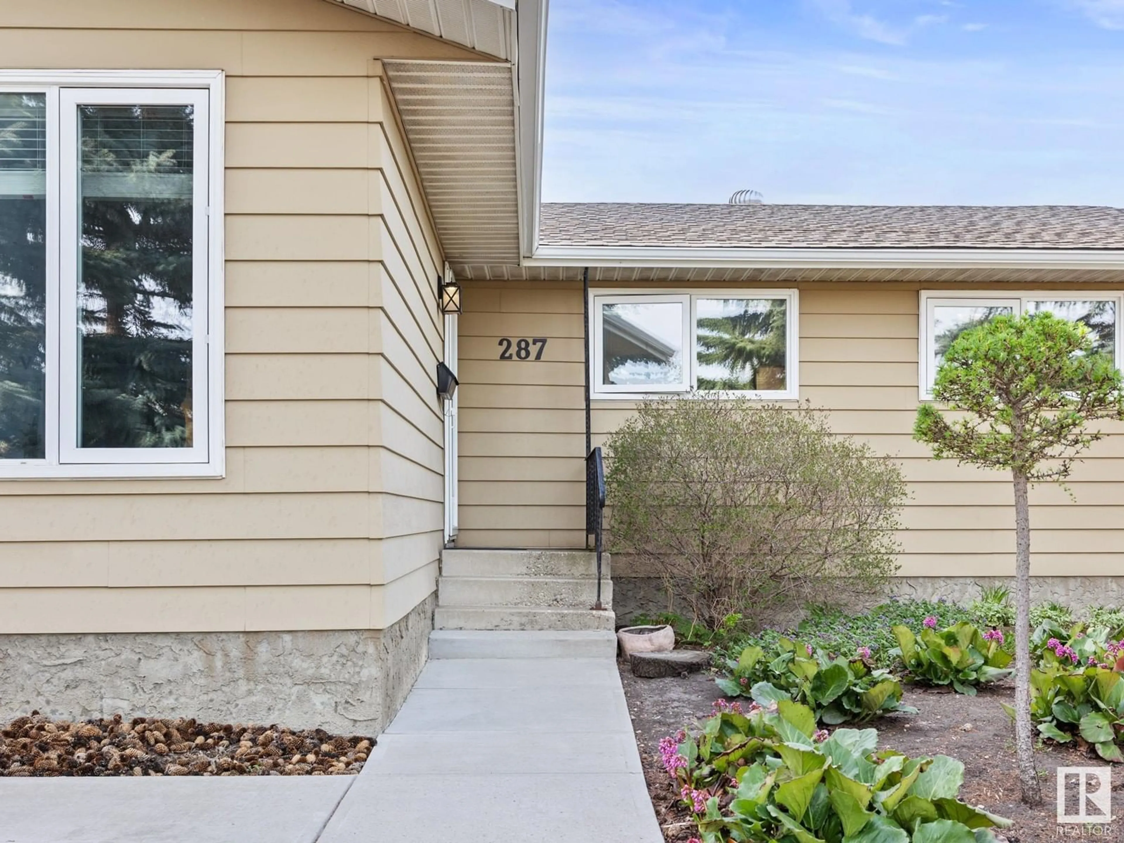 Home with vinyl exterior material, street for NW - 287 KNOTTWOOD RD N, Edmonton Alberta T6K2G5