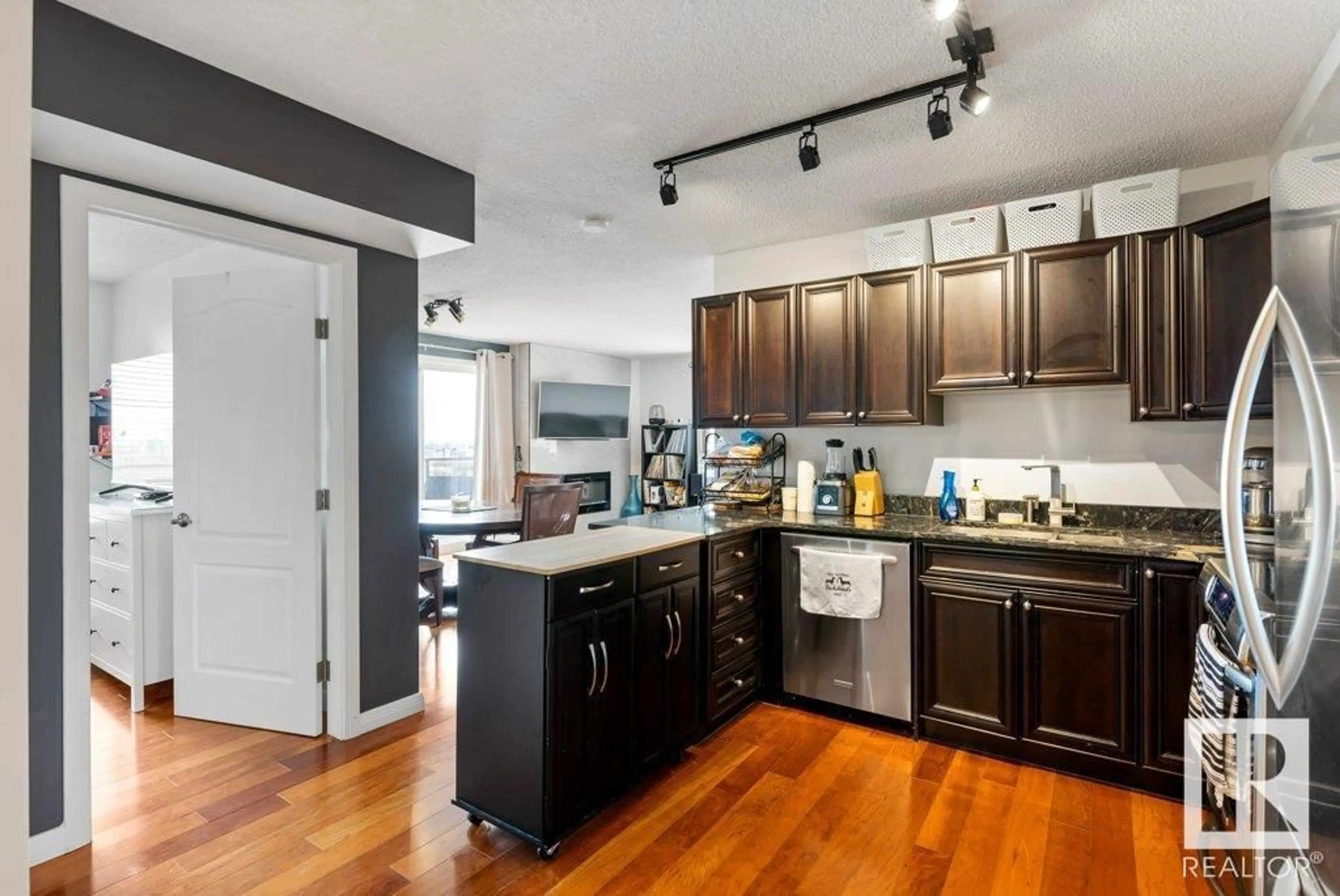 Open concept kitchen, wood/laminate floor for 1405 SASKATCHEWAN DR, Edmonton Alberta T6E6S8