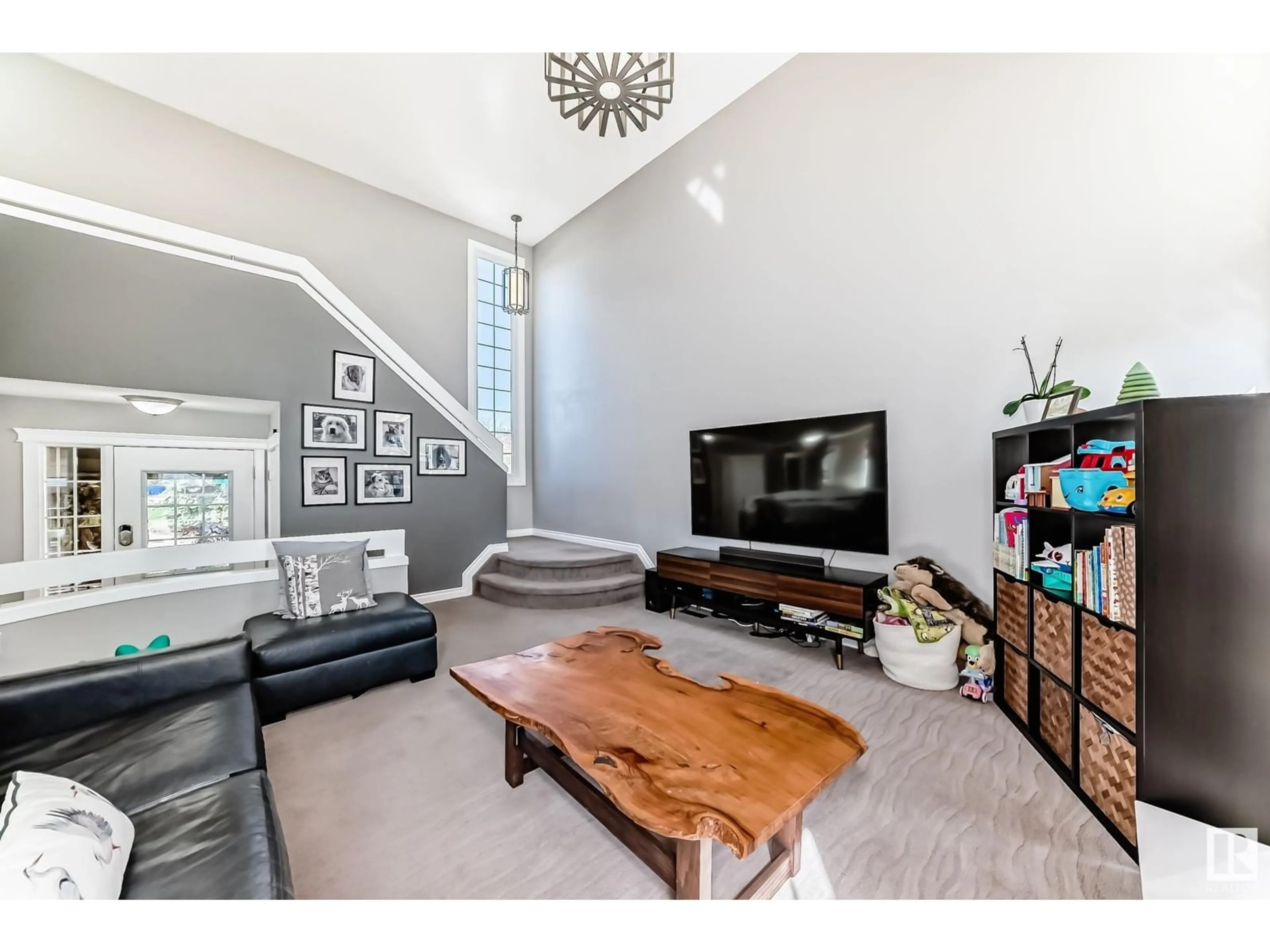 Living room with furniture, wood/laminate floor for 18535 70 AV, Edmonton Alberta T5T3A6