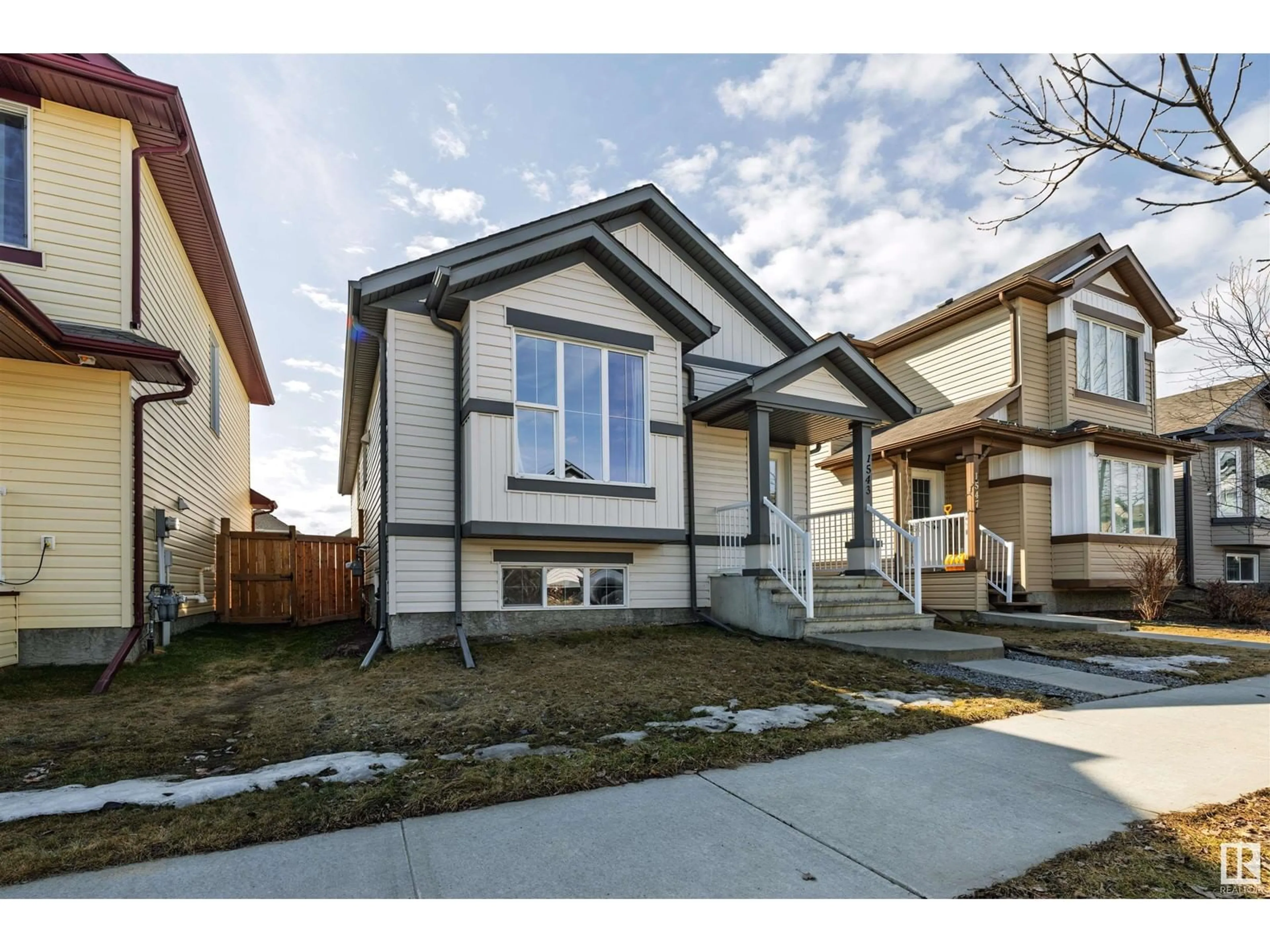 Home with vinyl exterior material, street for NW - 1543 35 AV, Edmonton Alberta T6T0M9