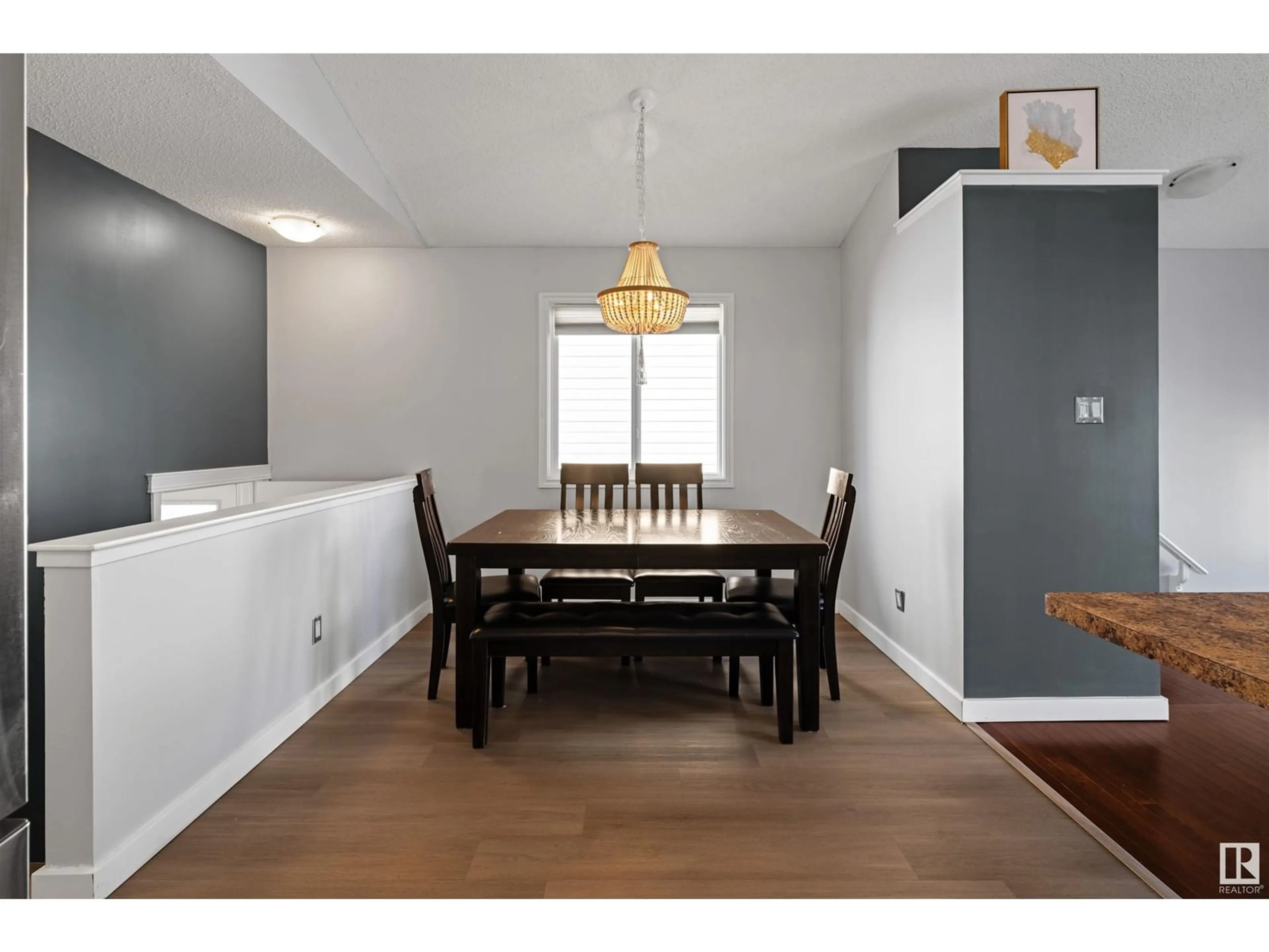 Dining room, wood/laminate floor for NW - 1543 35 AV, Edmonton Alberta T6T0M9