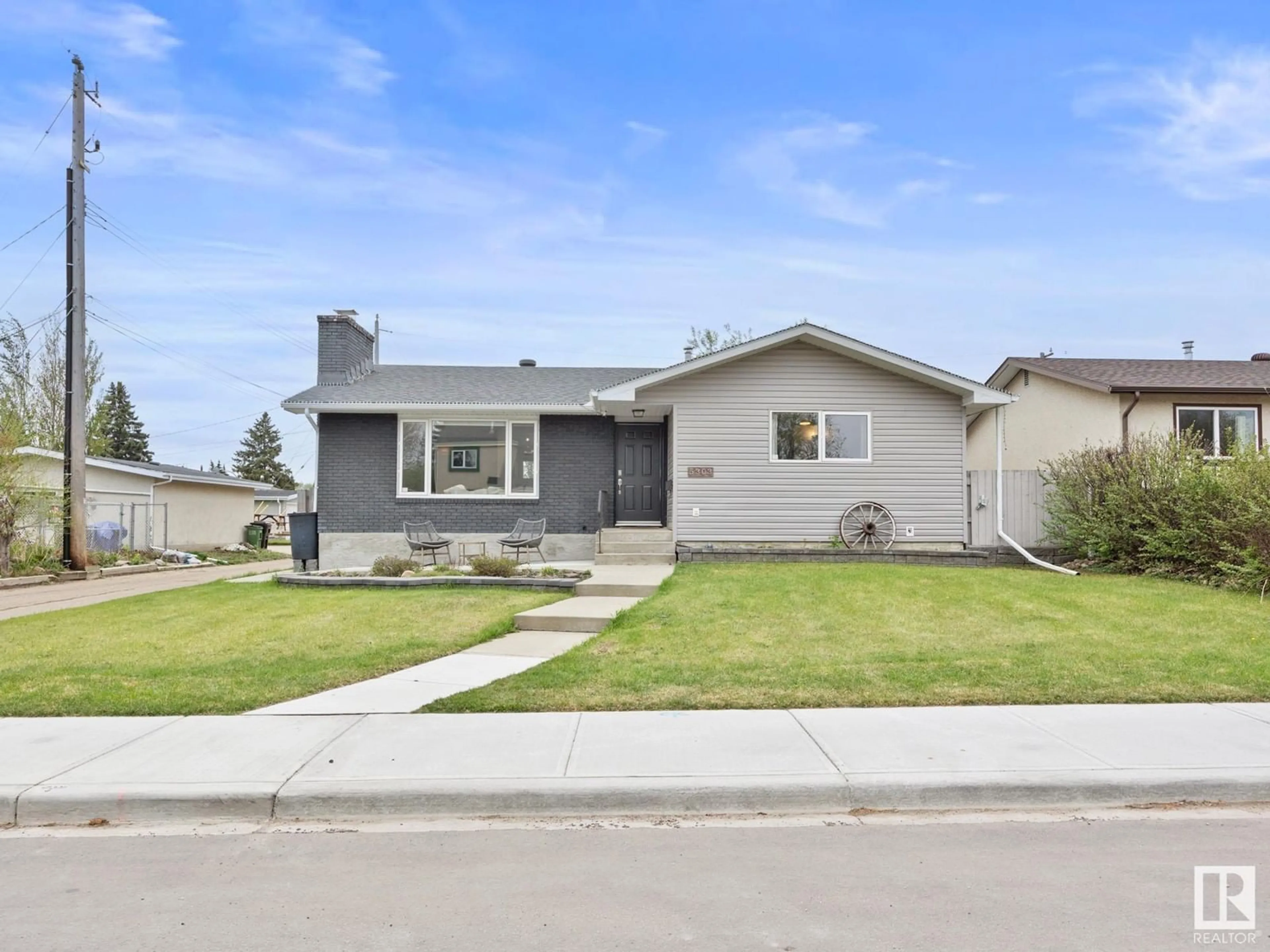 Home with vinyl exterior material, street for NW - 5303 92B AV, Edmonton Alberta T6B0V6