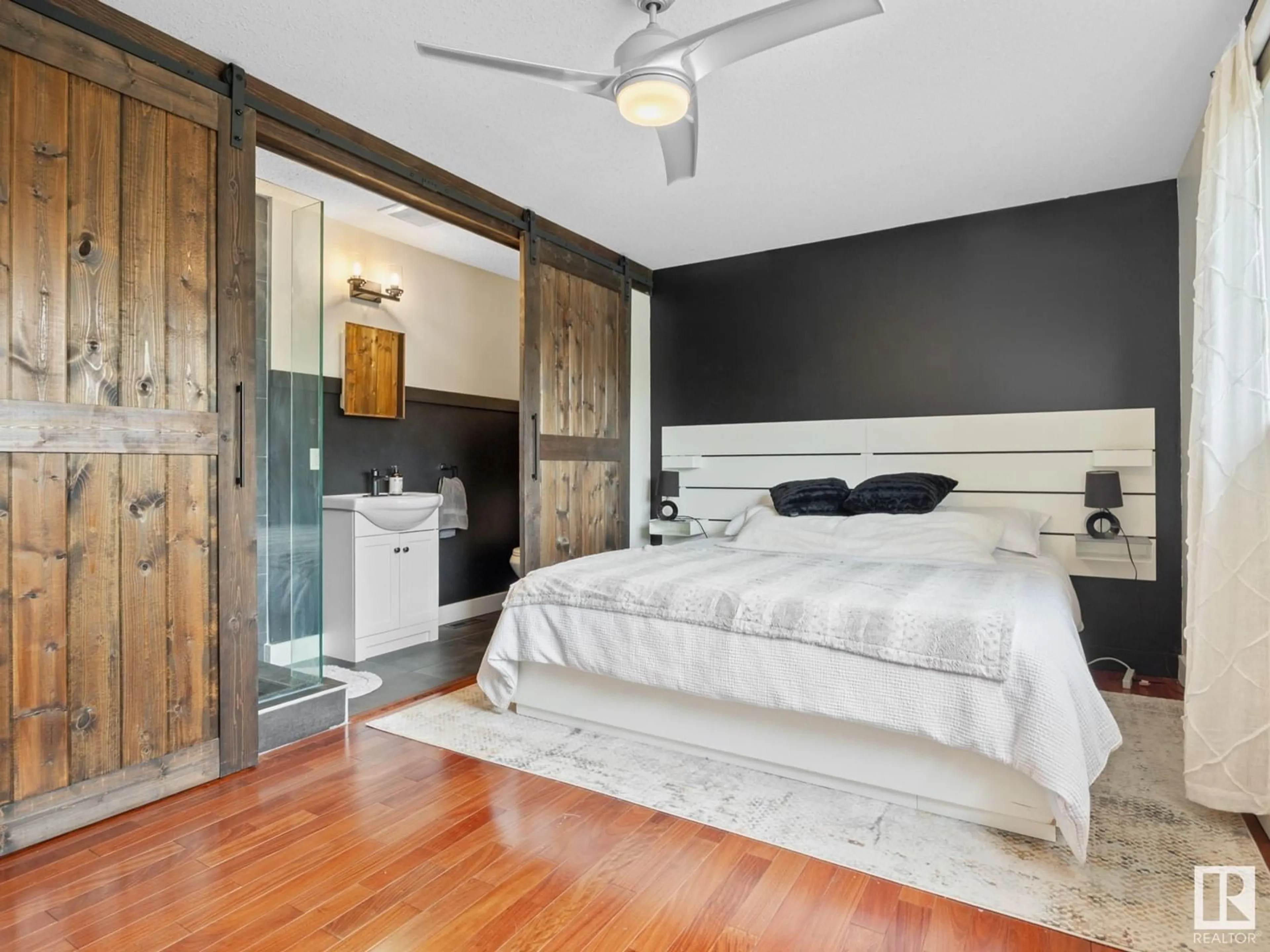 Bedroom with bed, wood/laminate floor for NW - 5303 92B AV, Edmonton Alberta T6B0V6