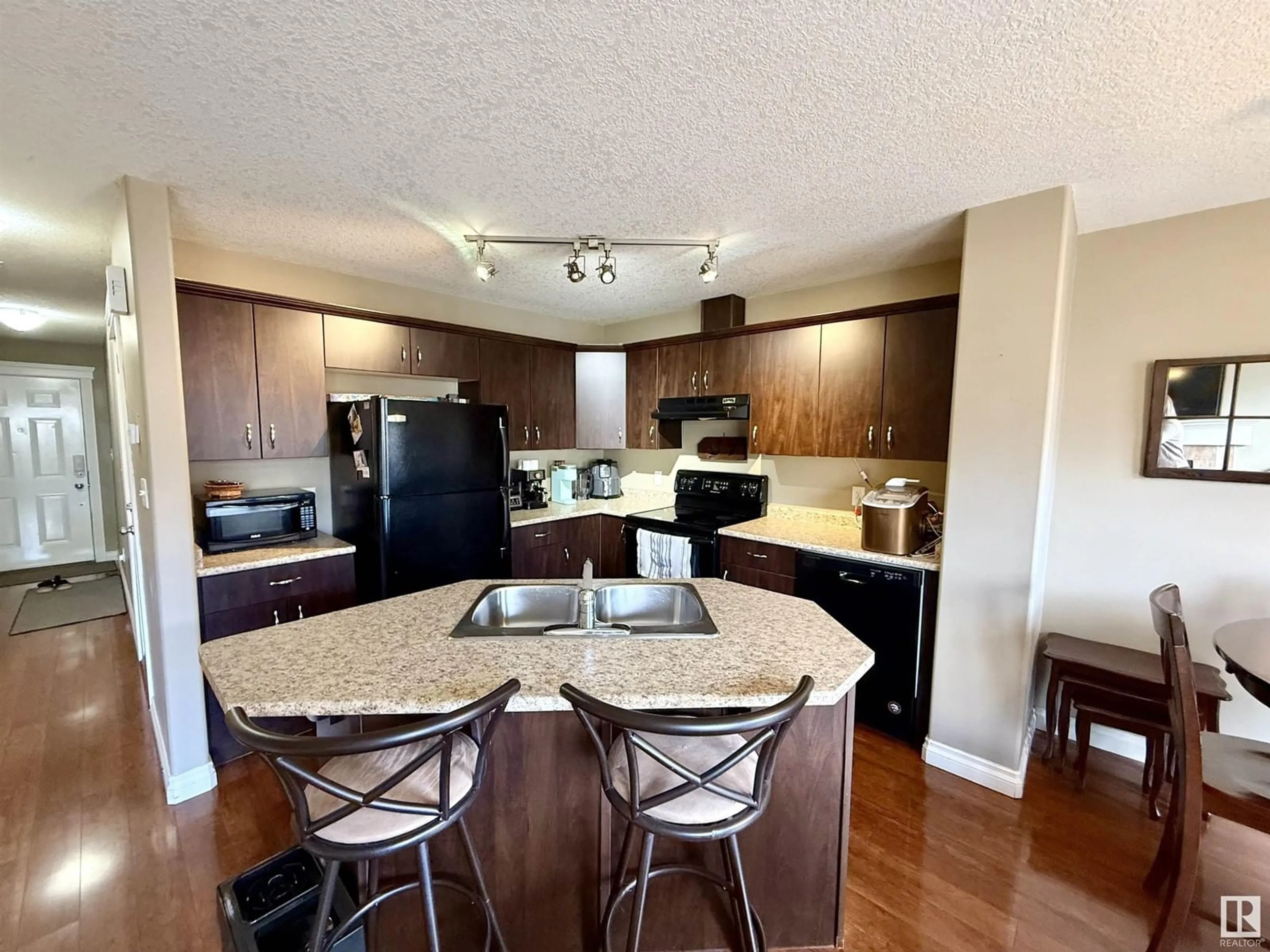 Open concept kitchen, wood/laminate floor for 33 MERIDIAN LO, Stony Plain Alberta T7Z0B8