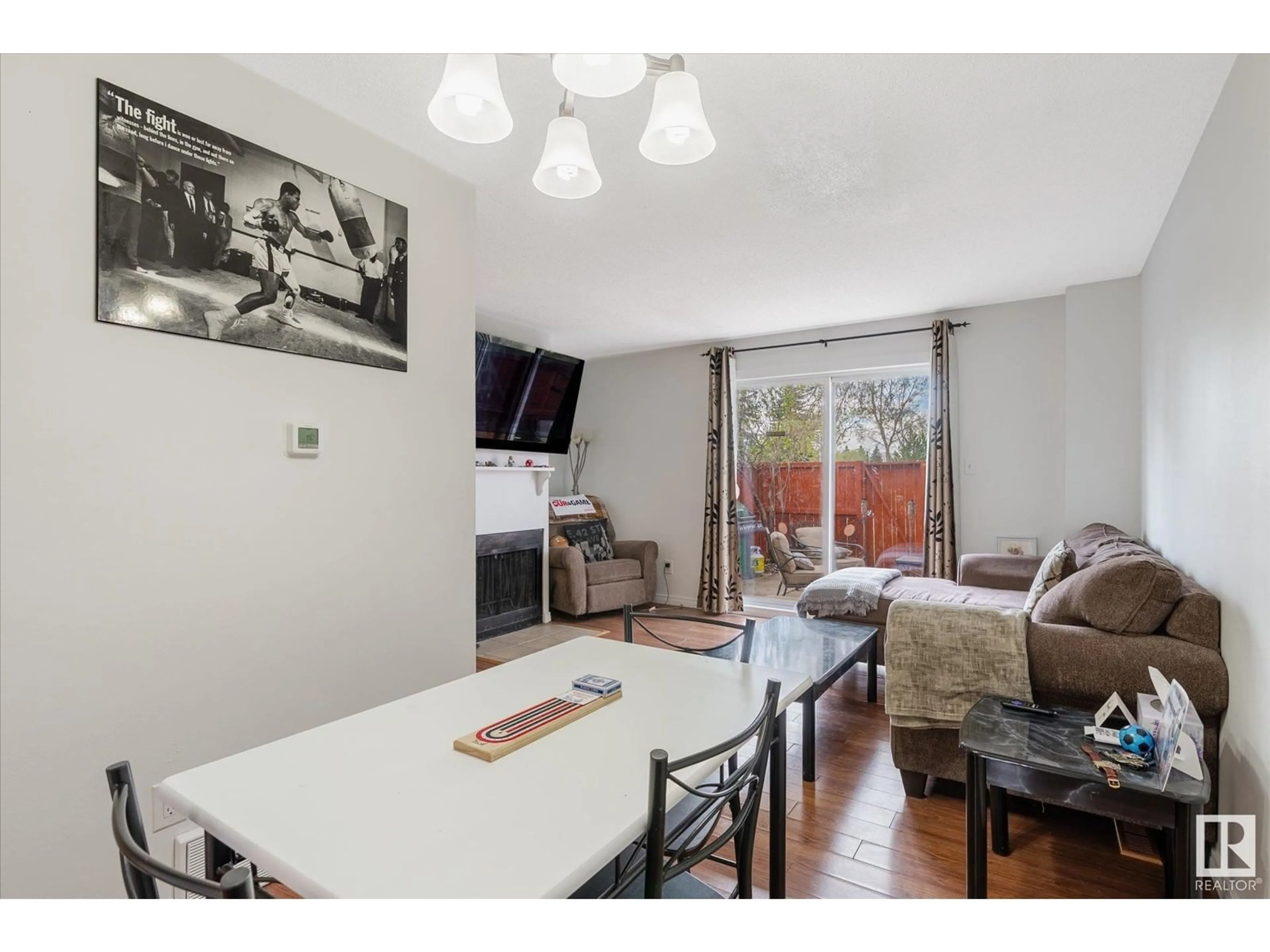 Living room with furniture, wood/laminate floor for 5610 148 ST, Edmonton Alberta T6H4T8