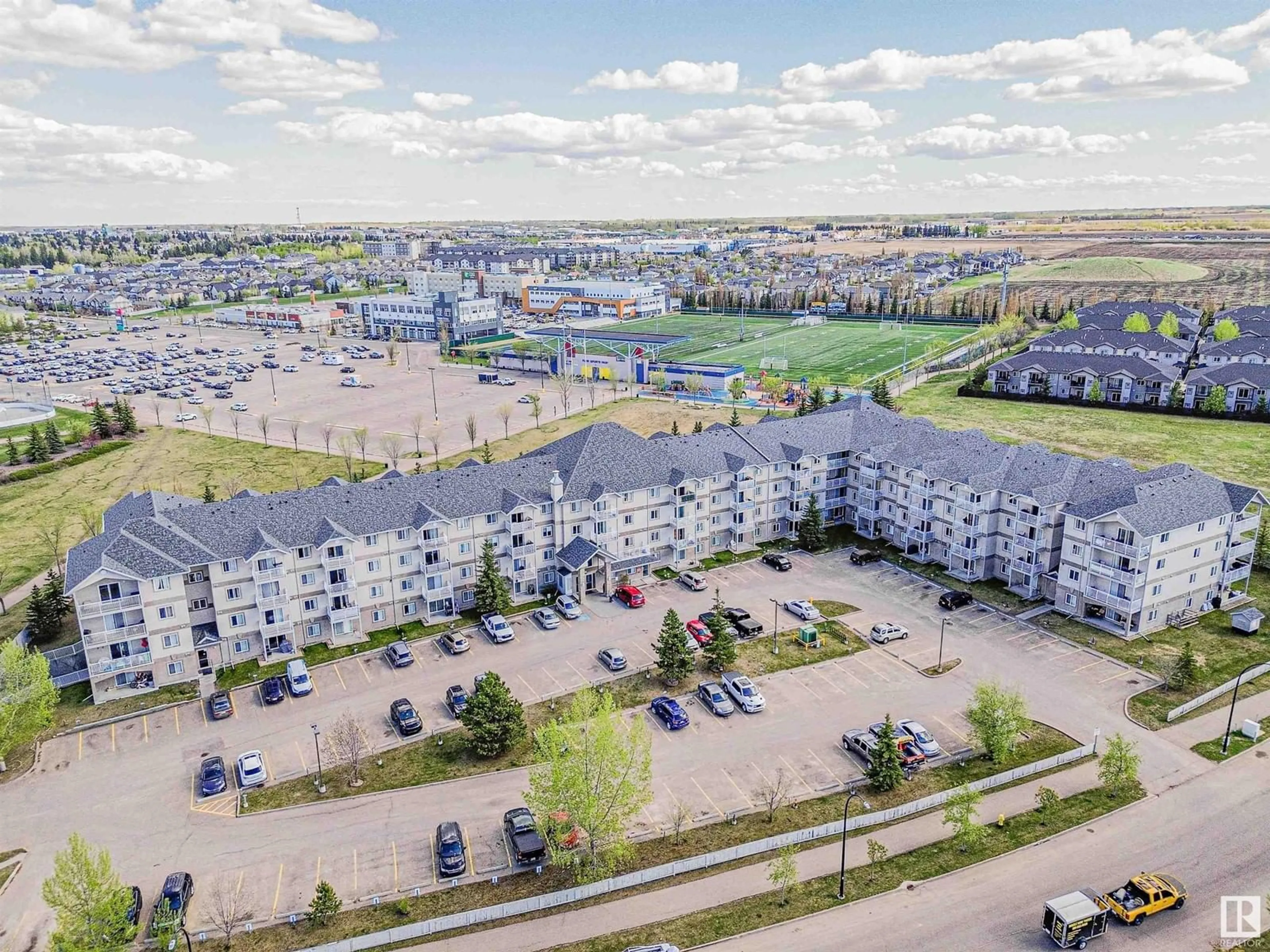 A pic from outside/outdoor area/front of a property/back of a property/a pic from drone, unknown for #208 - 240 SPRUCE RIDGE RD, Spruce Grove Alberta T7X0G5