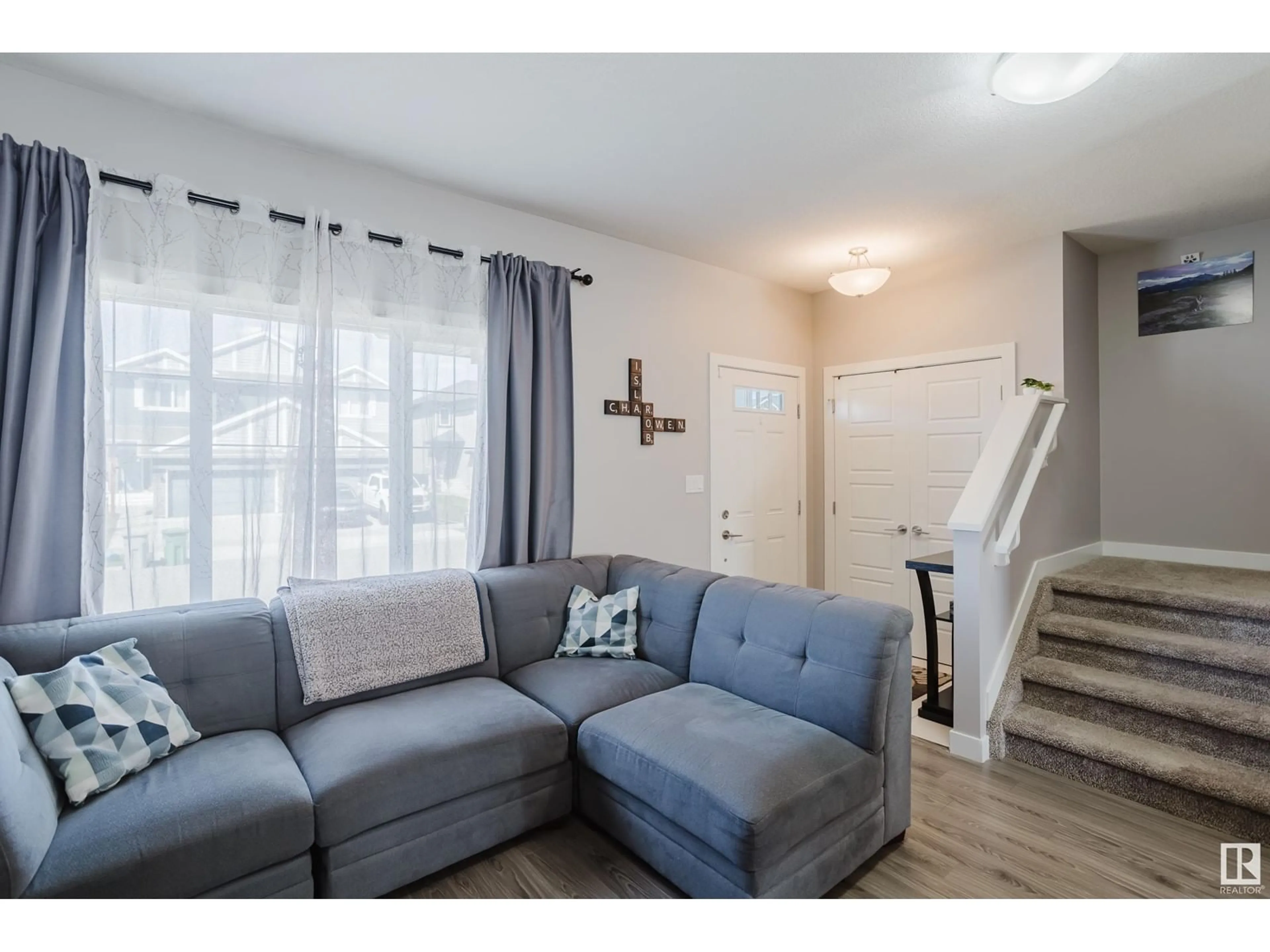 Living room with furniture, wood/laminate floor for 3601 49 AV, Beaumont Alberta T4X2B5