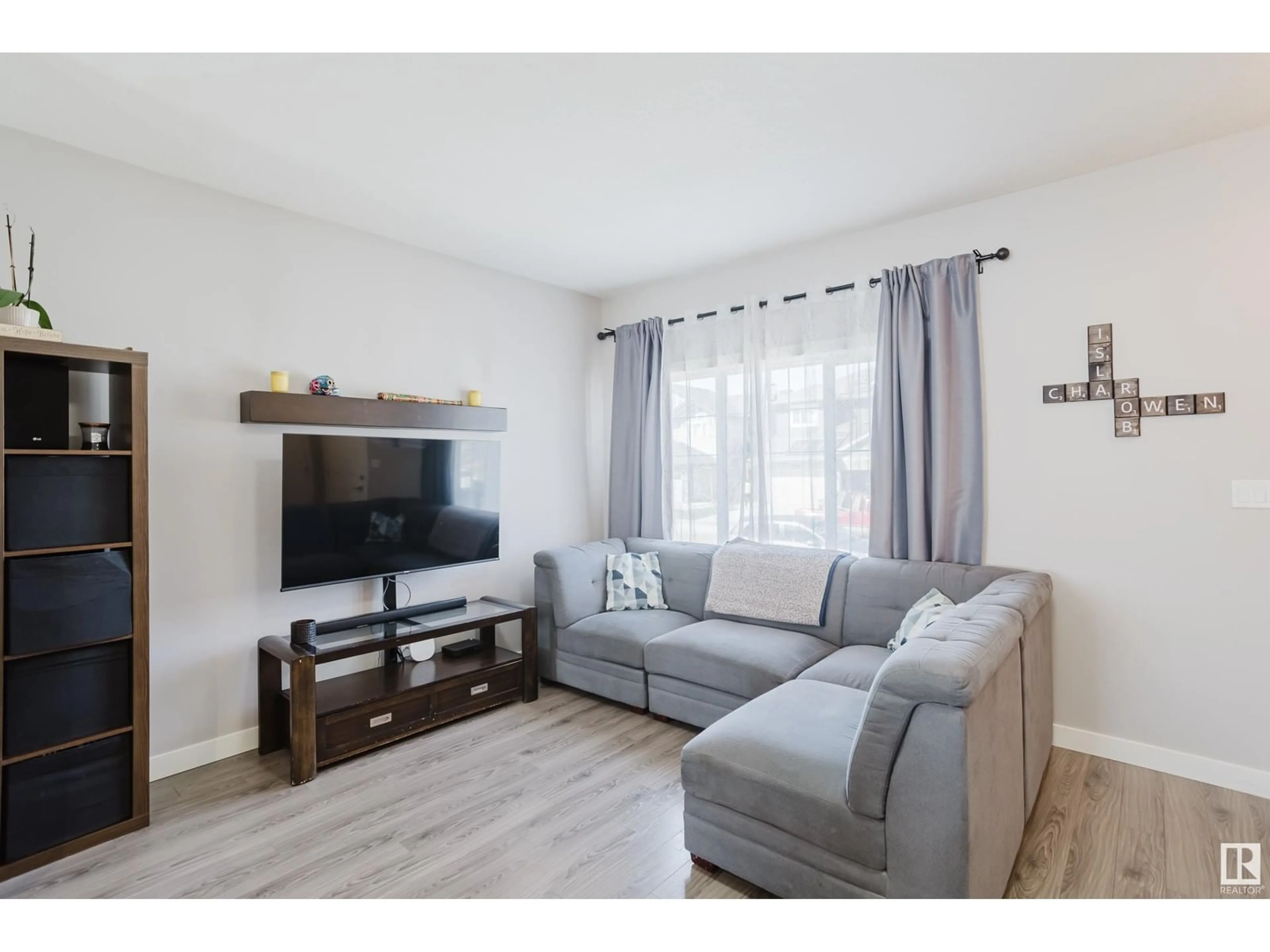 Living room with furniture, wood/laminate floor for 3601 49 AV, Beaumont Alberta T4X2B5
