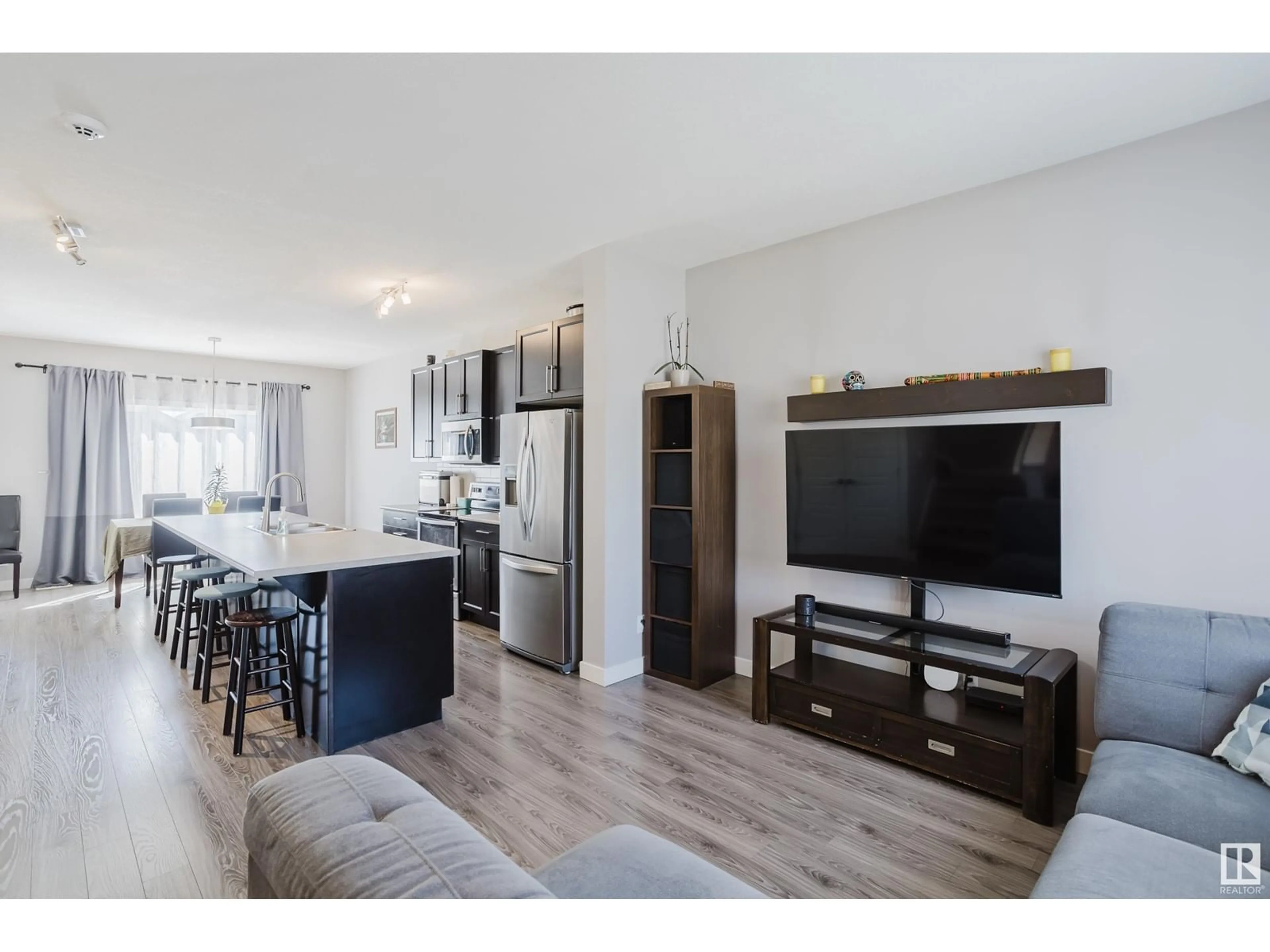 Open concept kitchen, wood/laminate floor for 3601 49 AV, Beaumont Alberta T4X2B5