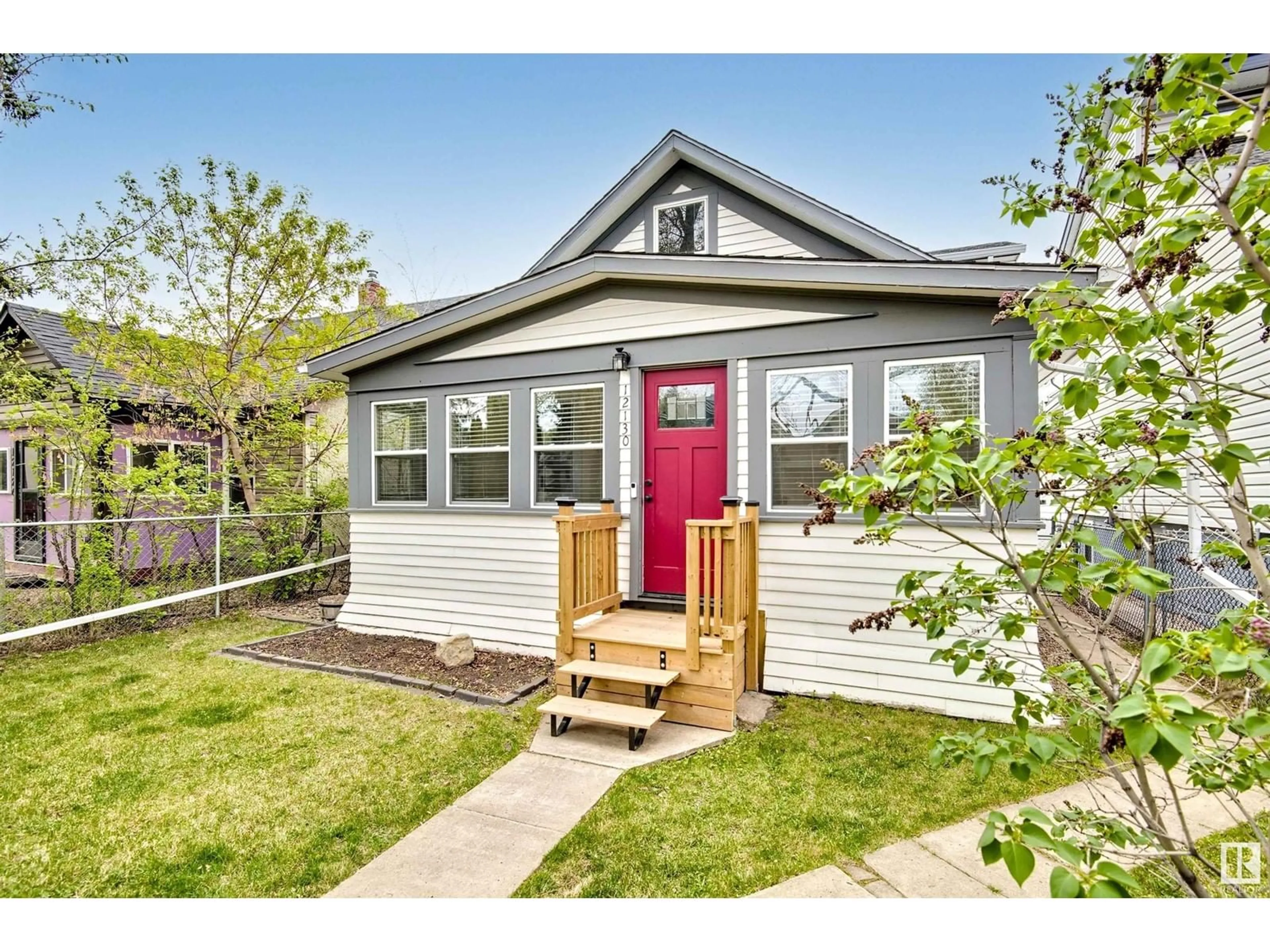 Home with vinyl exterior material, street for 12130 94 ST, Edmonton Alberta T5G1J9