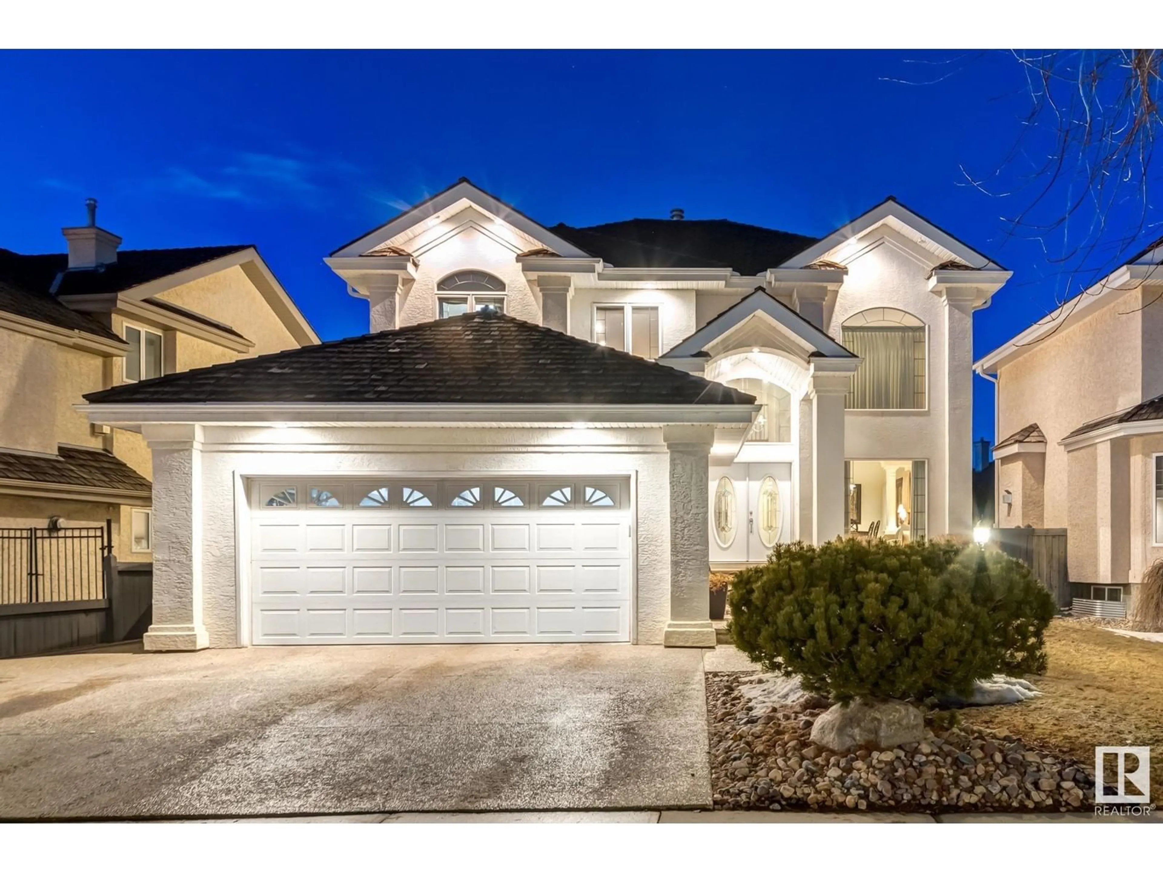 Home with vinyl exterior material, street for 203 DARLINGTON CR, Edmonton Alberta T6M2T2