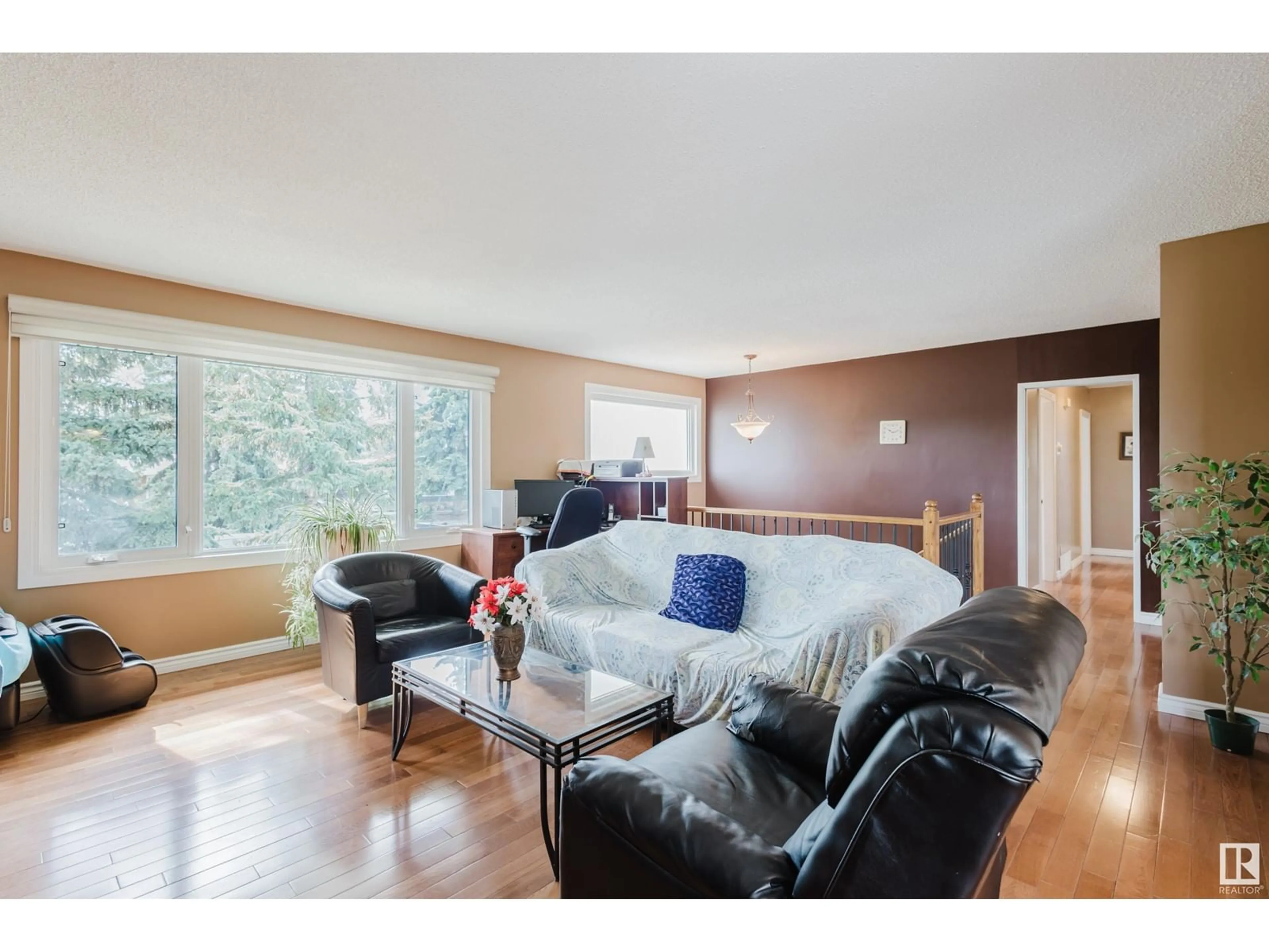Living room with furniture, wood/laminate floor for 4608 111A ST, Edmonton Alberta T6H3G5