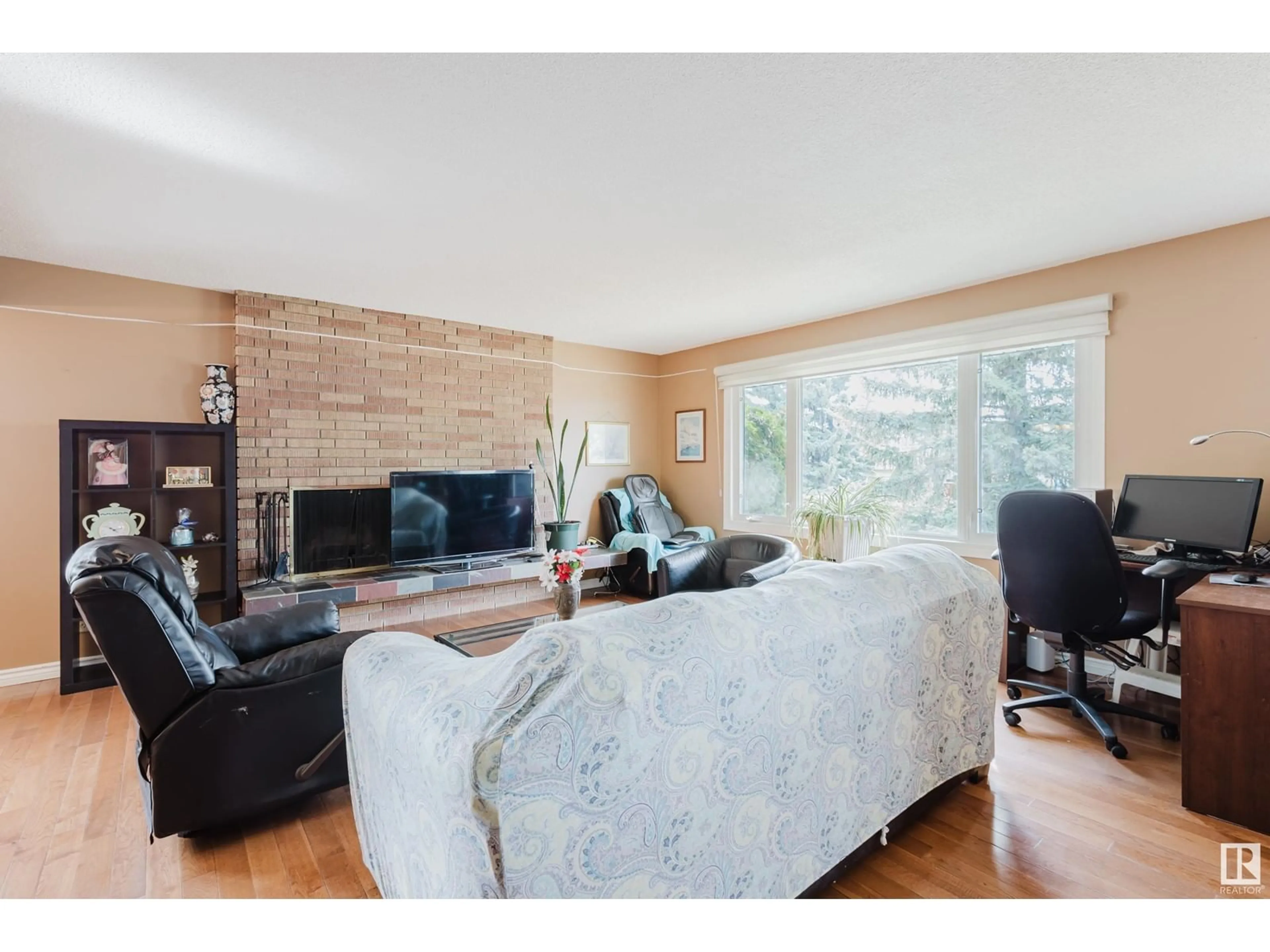 Living room with furniture, wood/laminate floor for 4608 111A ST, Edmonton Alberta T6H3G5